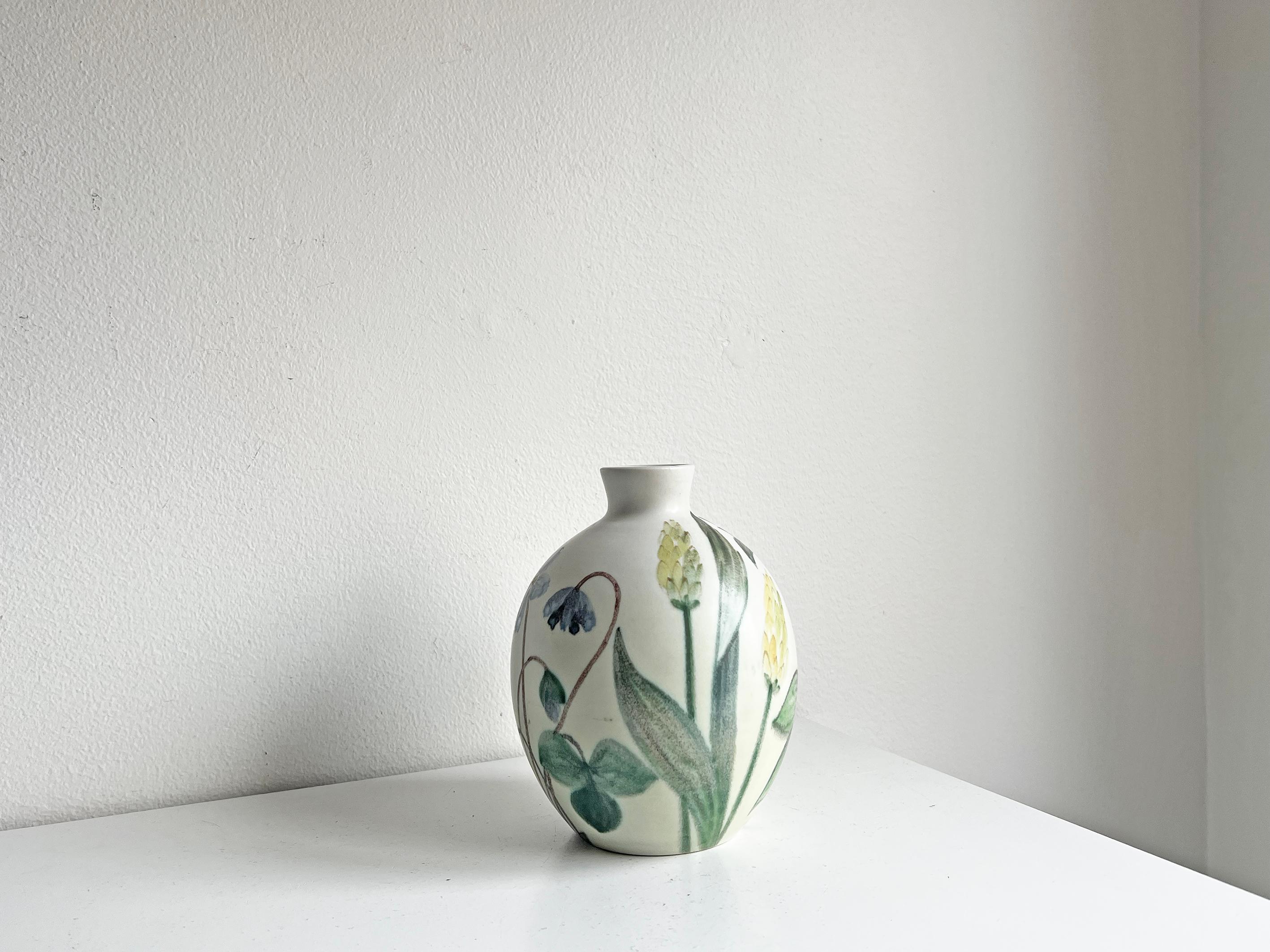Decorative vase by Carl-Harry Stålhane, produced by Rörstrand in Sweden.
Beautiful floral pattern. Signed with maker's mark.