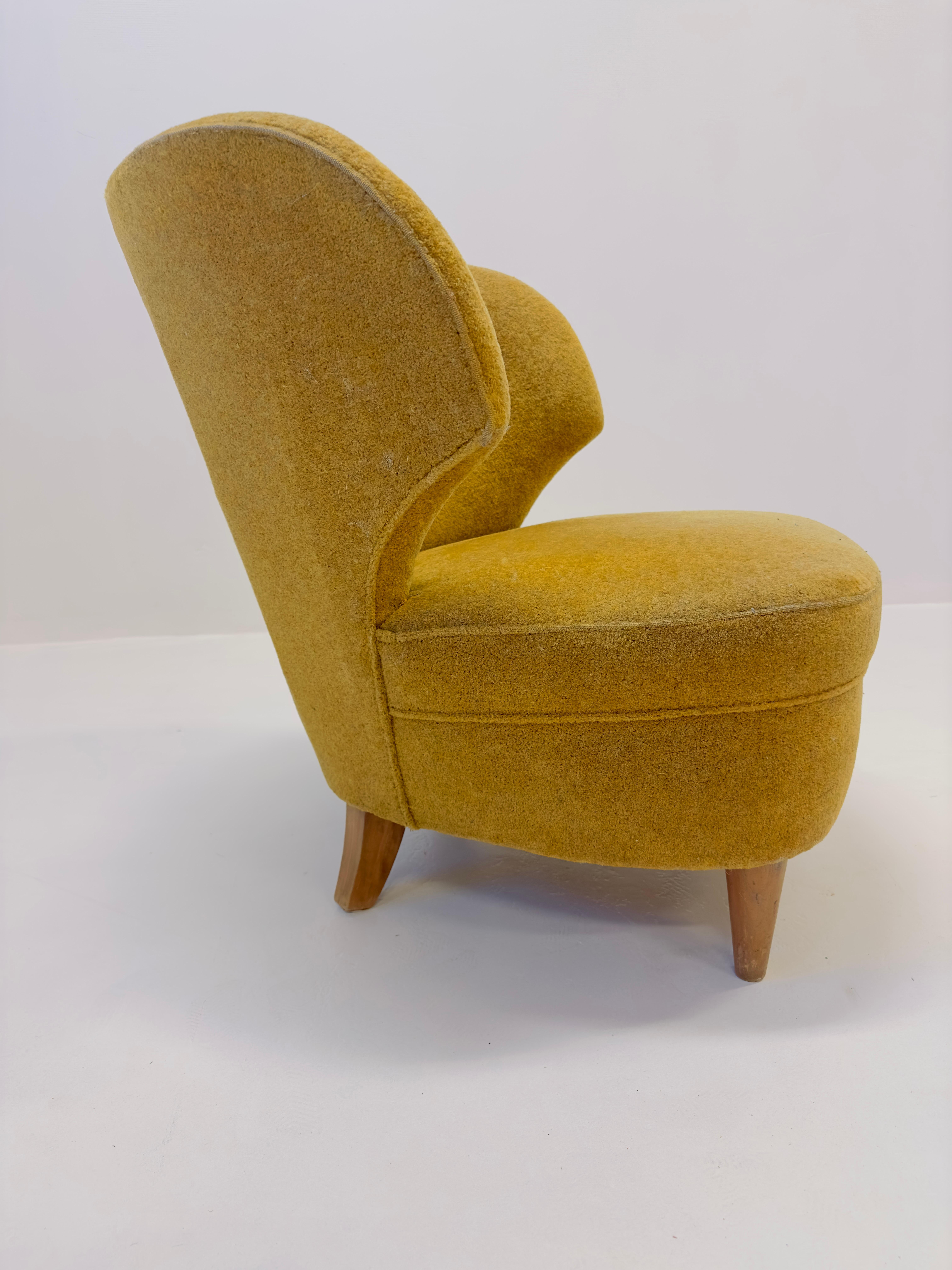 Rare pair of Carl-Johan Boman armchairs.

Price is for the pair.

Currently upholstered in mustard coloured fabric. 

Fast shipping from Sweden, all over the world. White glove packaging. 