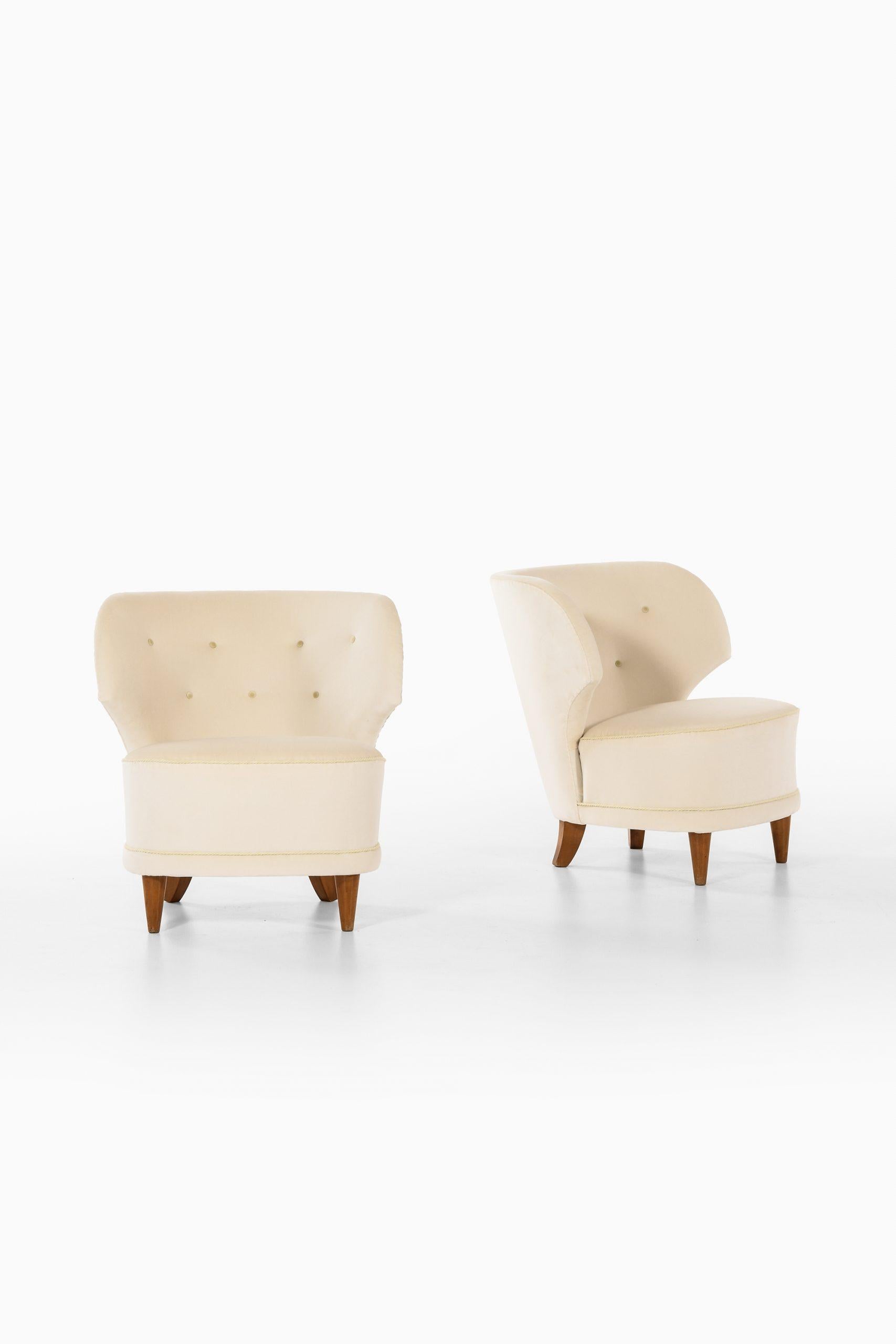 Rare pair of easy chairs designed by Carl-Johan Boman. Produced by Carl-Johan Boman in Finland.