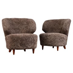 Carl-Johan Boman Pair of Finnish Curved Easy Chairs in Sahara Sheepskin, 1940s