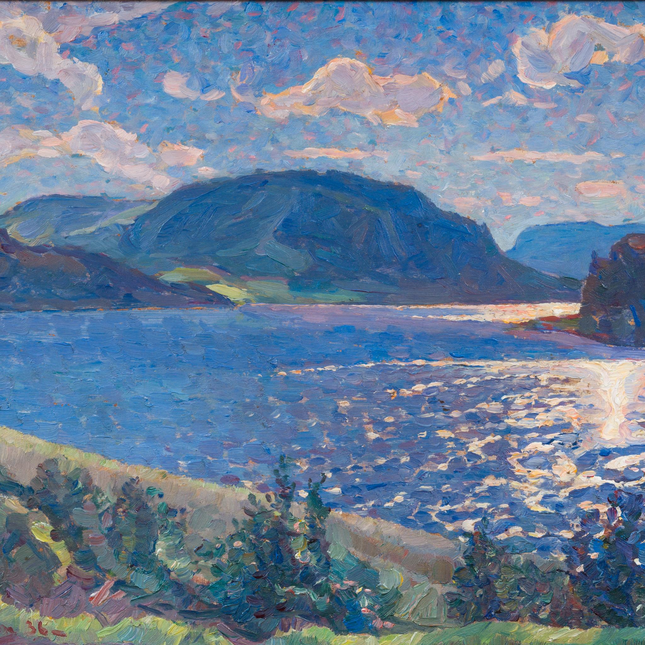 Luz vespertina sobre un lago de montaña en venta 3