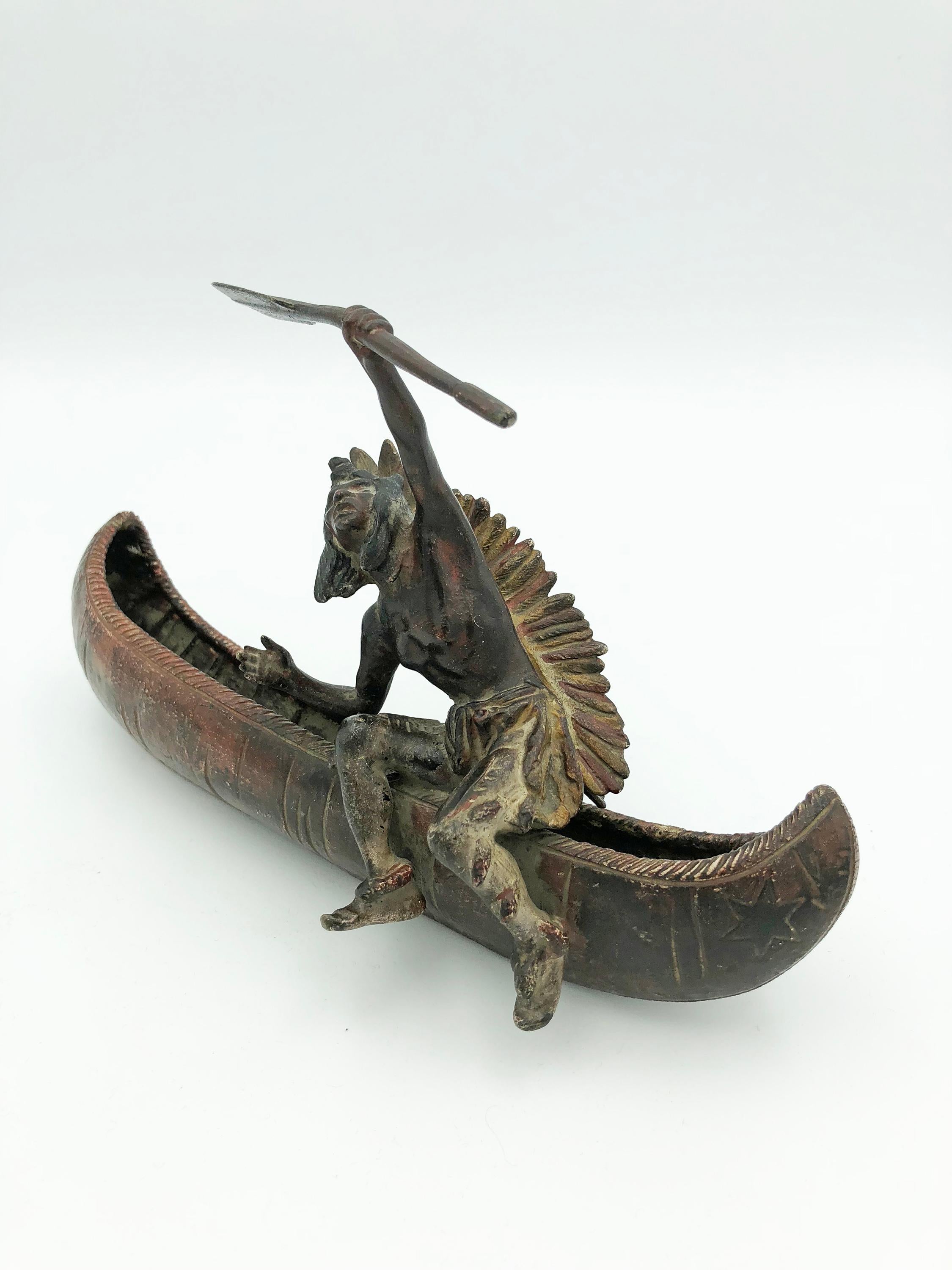 Native American in Canoe - Sculpture by Carl Kauba