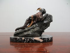 Native American Indian Eyes  behind a large Rock.