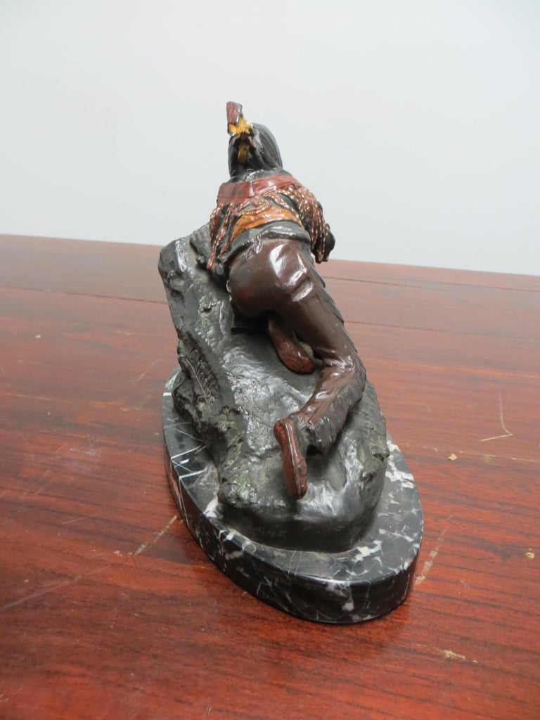 Indian Eyes, by Austrian artist Carl Kauba shows an Native American behind a large rock. Is he hiding? and if so, from whom and why? That is left for the viewers imagination.
This statue is cast in the finest American bronze, finished in the