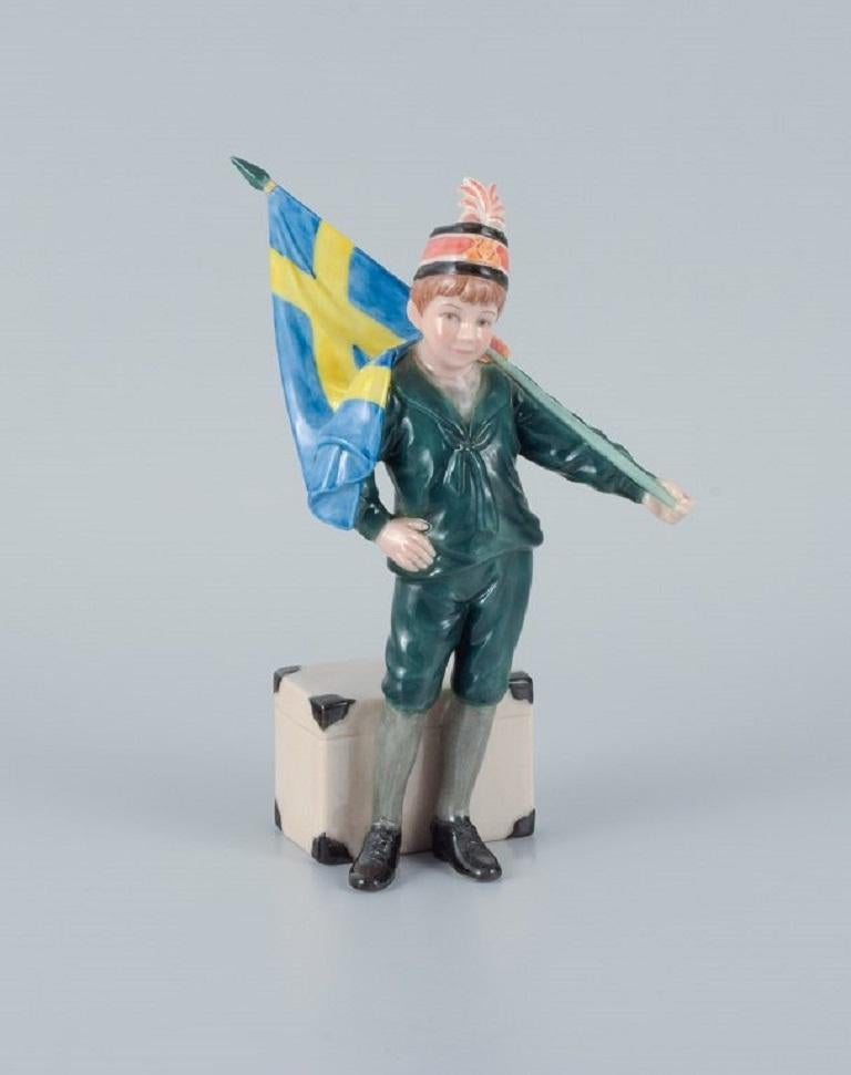 Carl Larsson Pontus for Royal Copenhagen.
Hand-painted porcelain figure in overglaze, Swedish standard-bearer boy in green clothes.
2000s.
First factory quality.
In perfect condition.
Stamped: Limited Edition 281/7500
Dimensions: H 19.0 x D