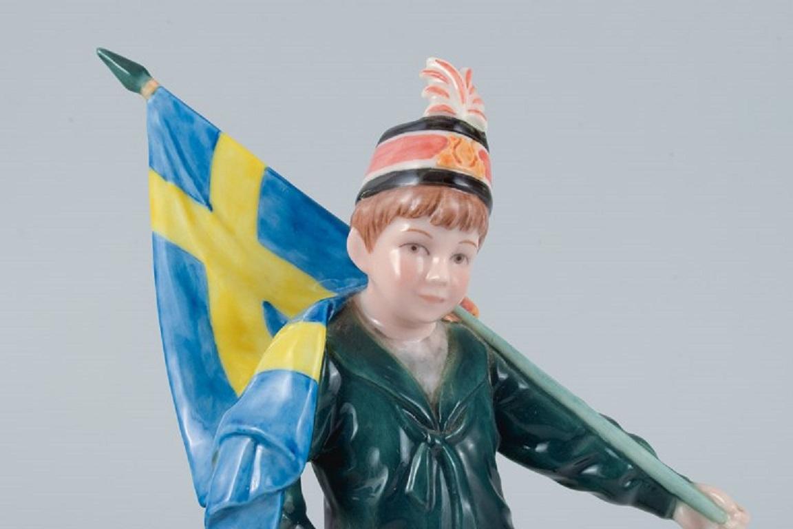Danish Carl Larsson Pontus for Royal Copenhagen, Porcelain Figure, Standard-Bearer Boy For Sale