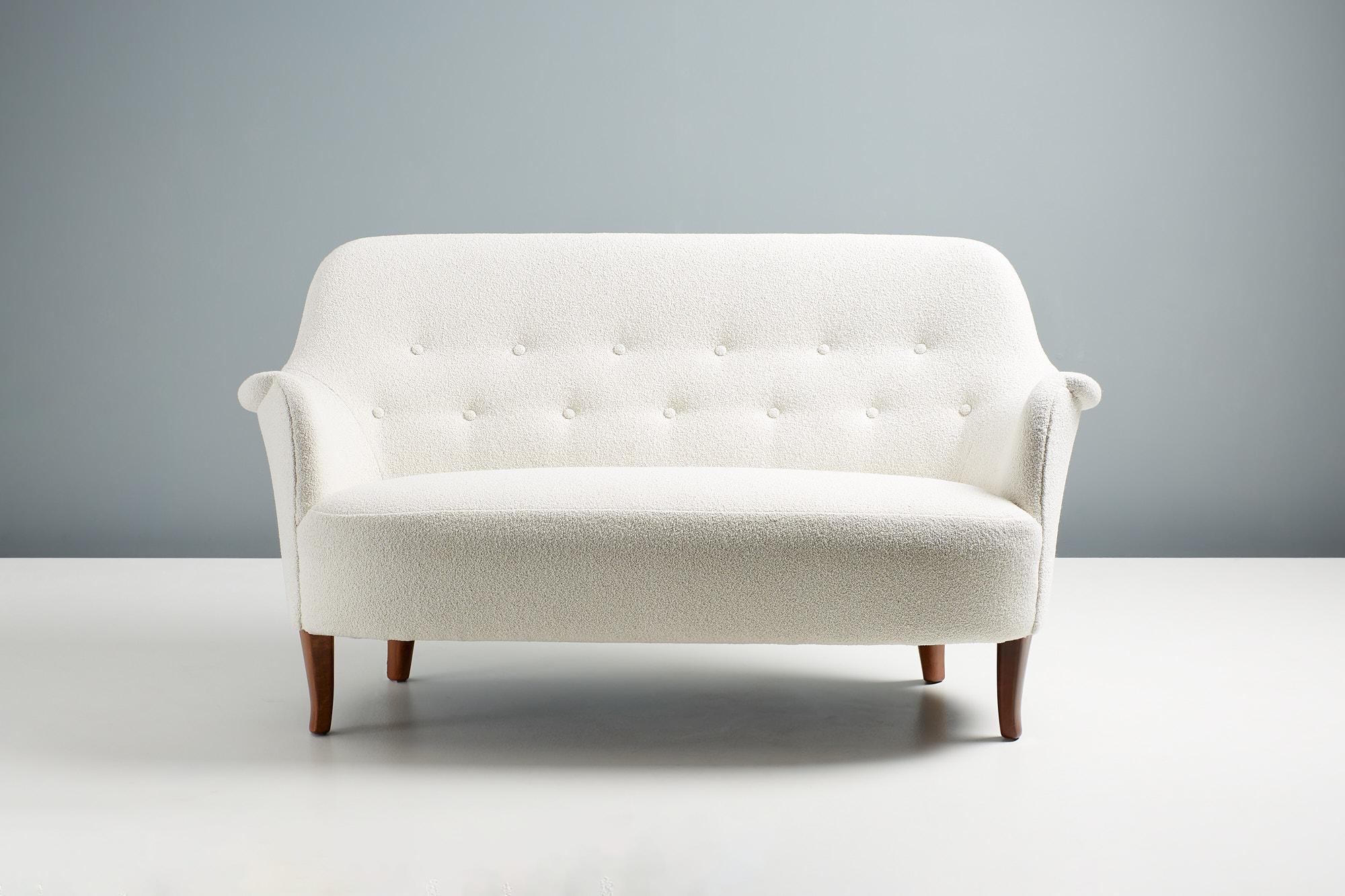Carl Malmsten - Cirkus Sofa, c1950s

Model 'Cirkus' love-seat sofa, designed in the 1950s by Swedish Master designer Carl Malmsten and produced by OH Sjögren in Tranås, Sweden. The sofa has restored and re-finsiehd stained elm wood legs and has