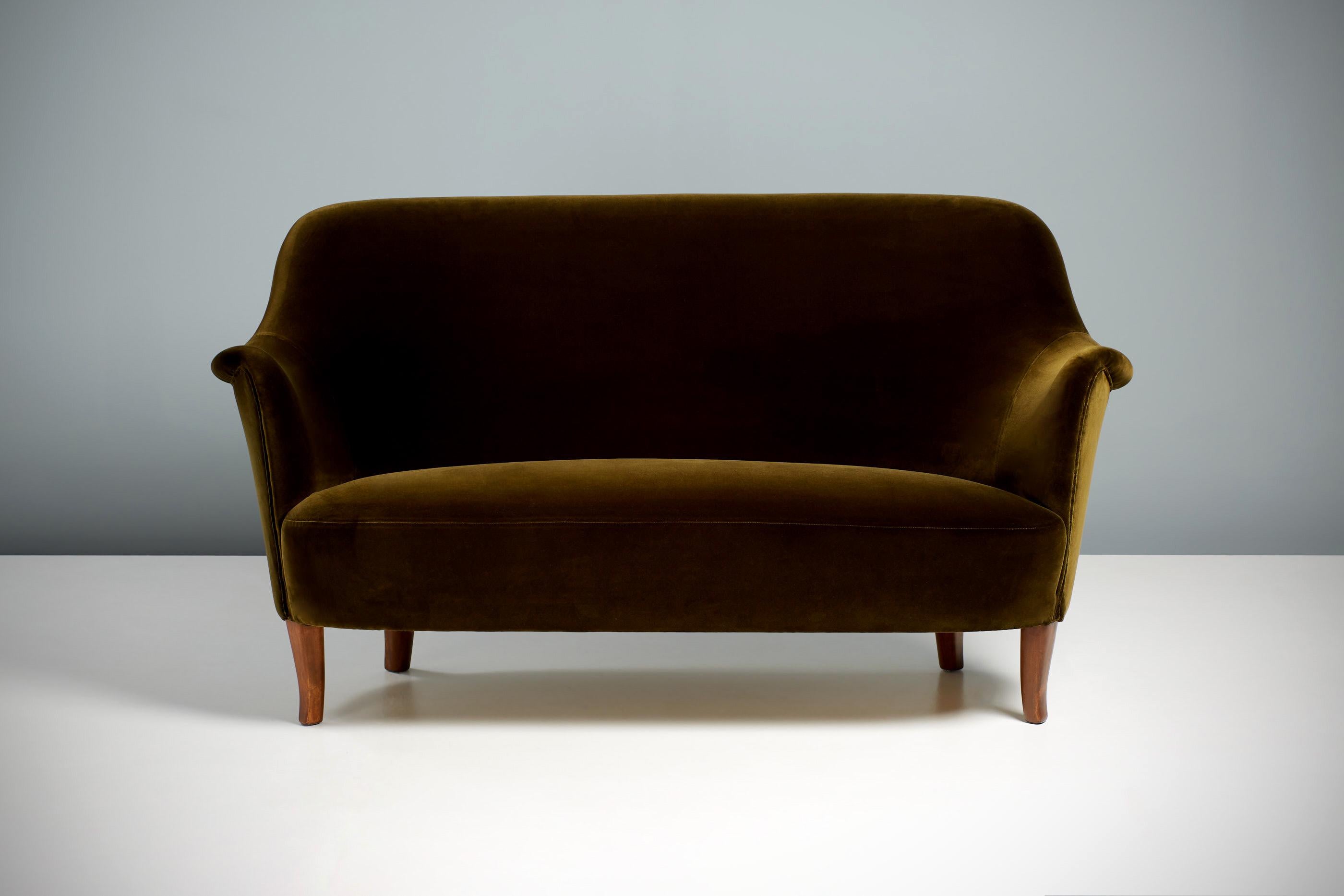 Carl Malmsten - Cirkus sofa, c1950s

The Cirkus sofa was designed in the 1950s by Swedish Master Carl Malmsten and produced by OH Sjögren in Tranås, Sweden. This example has been restored and the elm wood legs re-finished. The sofa has been