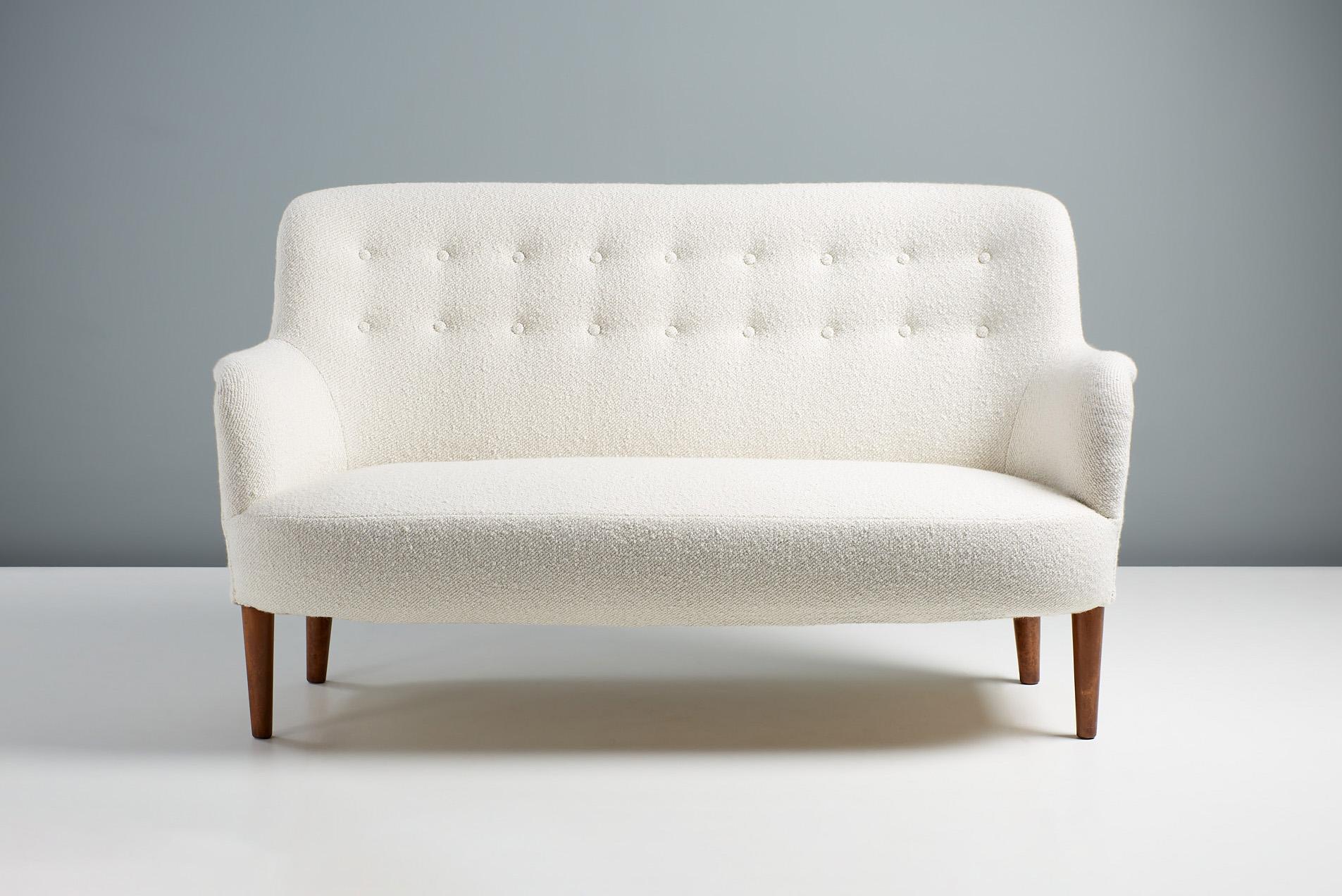 Carl Malmsten - Sofa, c1950s.

Small sofa designed in the 1950s by Swedish master-designer Carl Malmsten and produced by his own company in Sweden. The sofa has been restored and re-finished with oiled elm wood legs. It has been reupholstered in