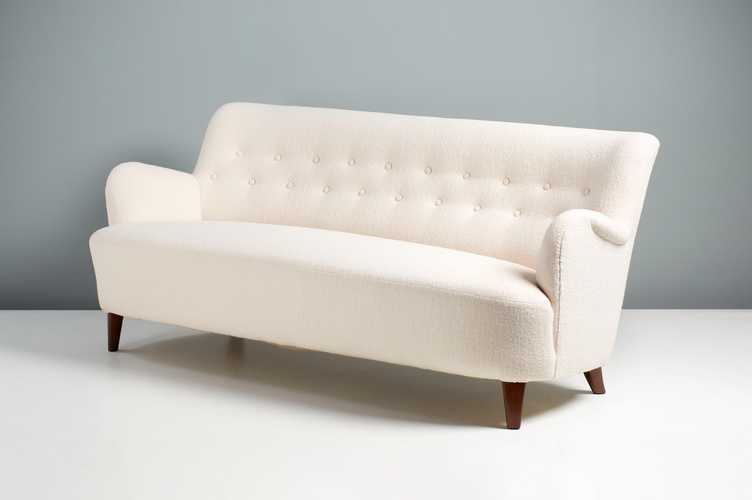 Carl Malmsten Sofa, circa 1950s.

A 3-seat sofa, designed in the 1950s by Swedish Master designer: Carl Malmsten and produced in Sweden. The sofa has stained elm wood legs and has been reupholstered in Chase Erwin ‘Laine Snow’ pure wool fabric.