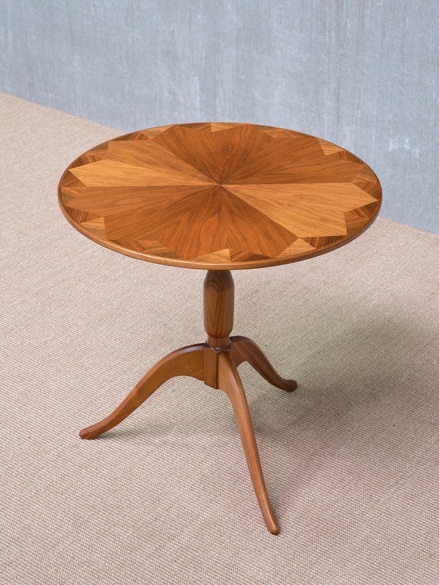 This elegant side table was designed by Carl Malmsten in 1951 and is known as the Båstad model, named after the town where Malmsten's close friend, the iconic textile artist Märta Måås-Fjetterström, was based. The table was crafted by cabinetmaker