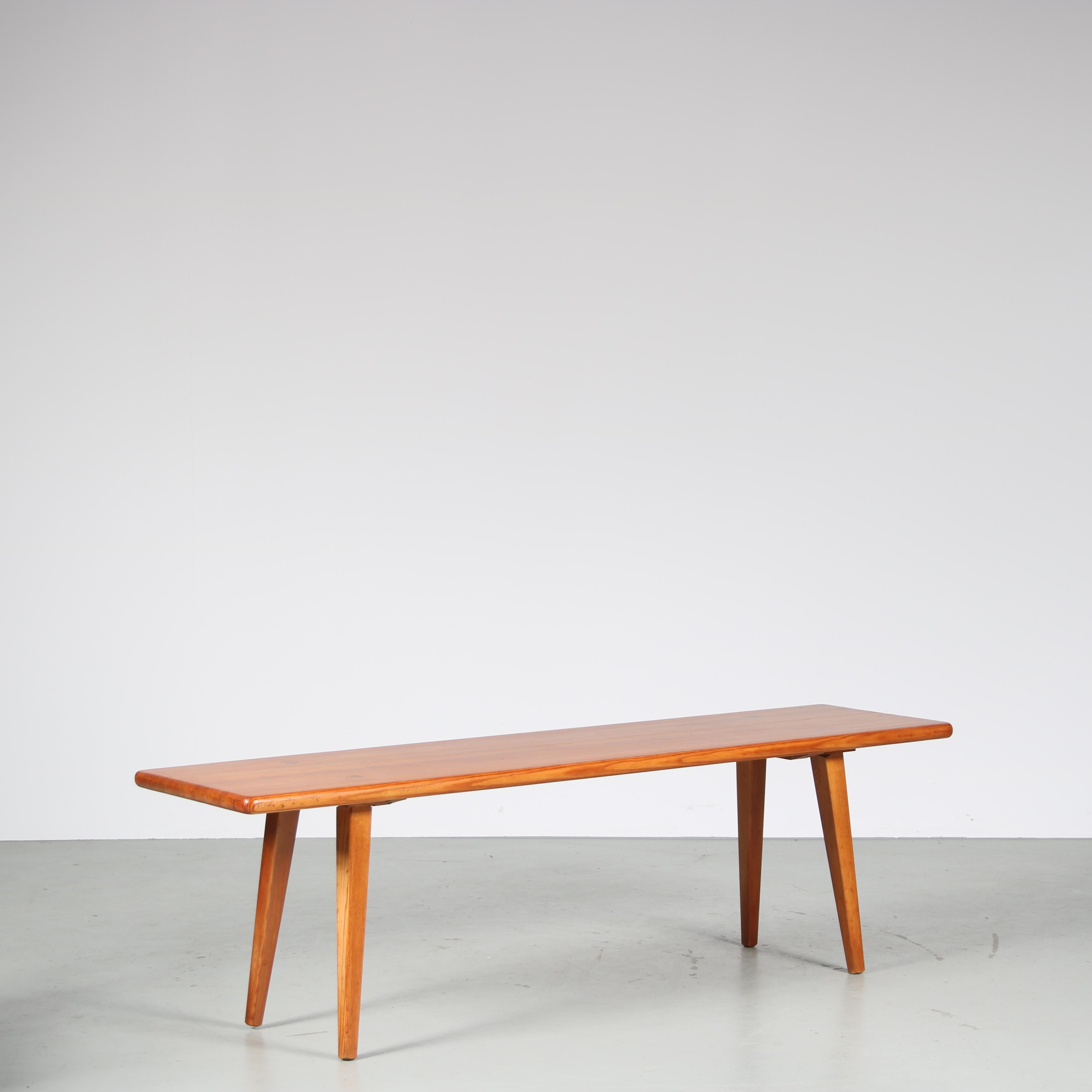 A wonderful pine wooden bench designed by Carl Malmsten, manufactured by Svensk Fur in Sweden around 1960. 

The bench is made of warm brown coloured pine wood. The narrow rectangular top / seat is held by four gently tapered legs. The top reveals