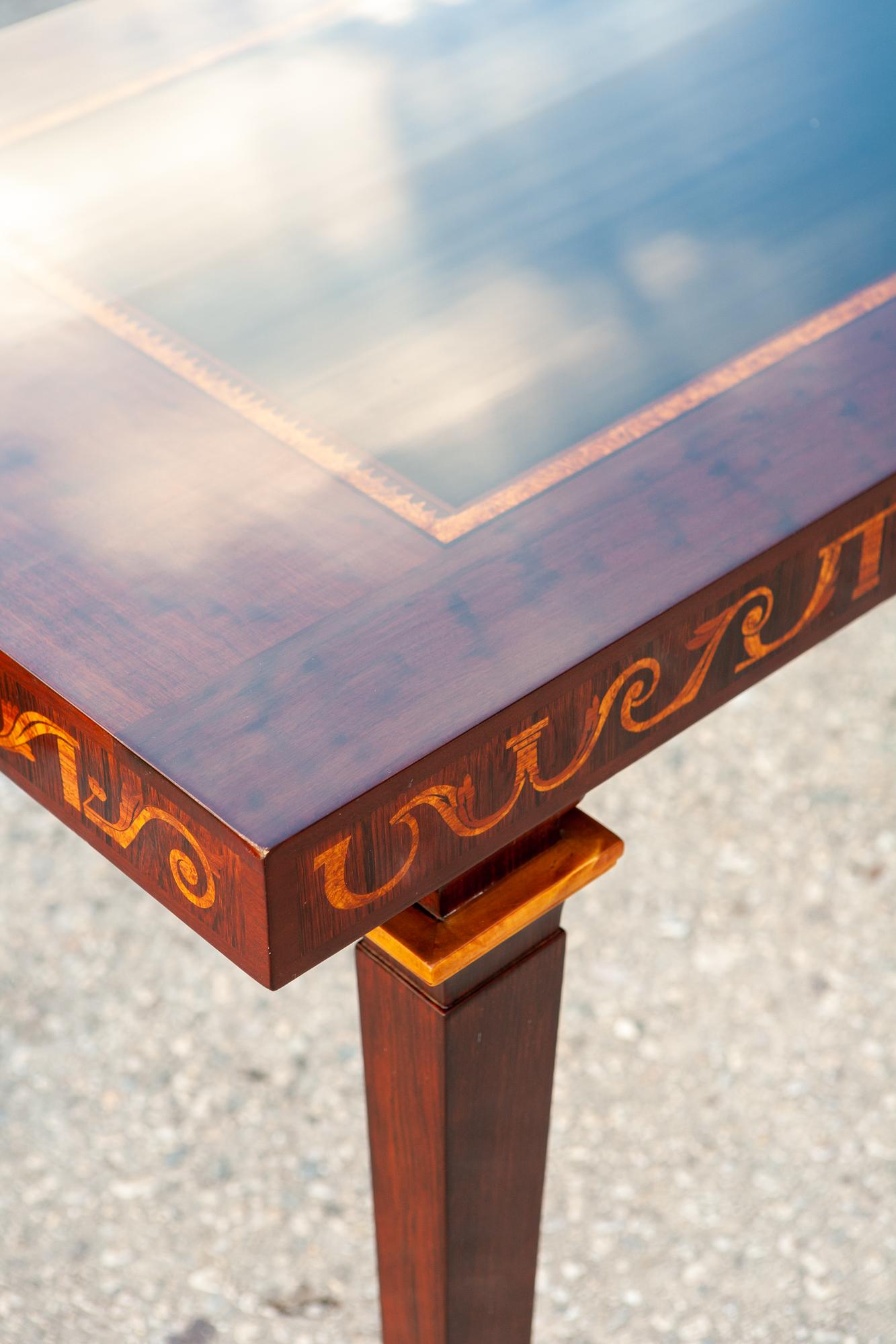 Monumental, Swedish marquetry inlaid console table designed by Carl Malmsten (1888 - 1972). Retailed by Nordiska Kompaniet. Marked with CM Brand, NK Disk.