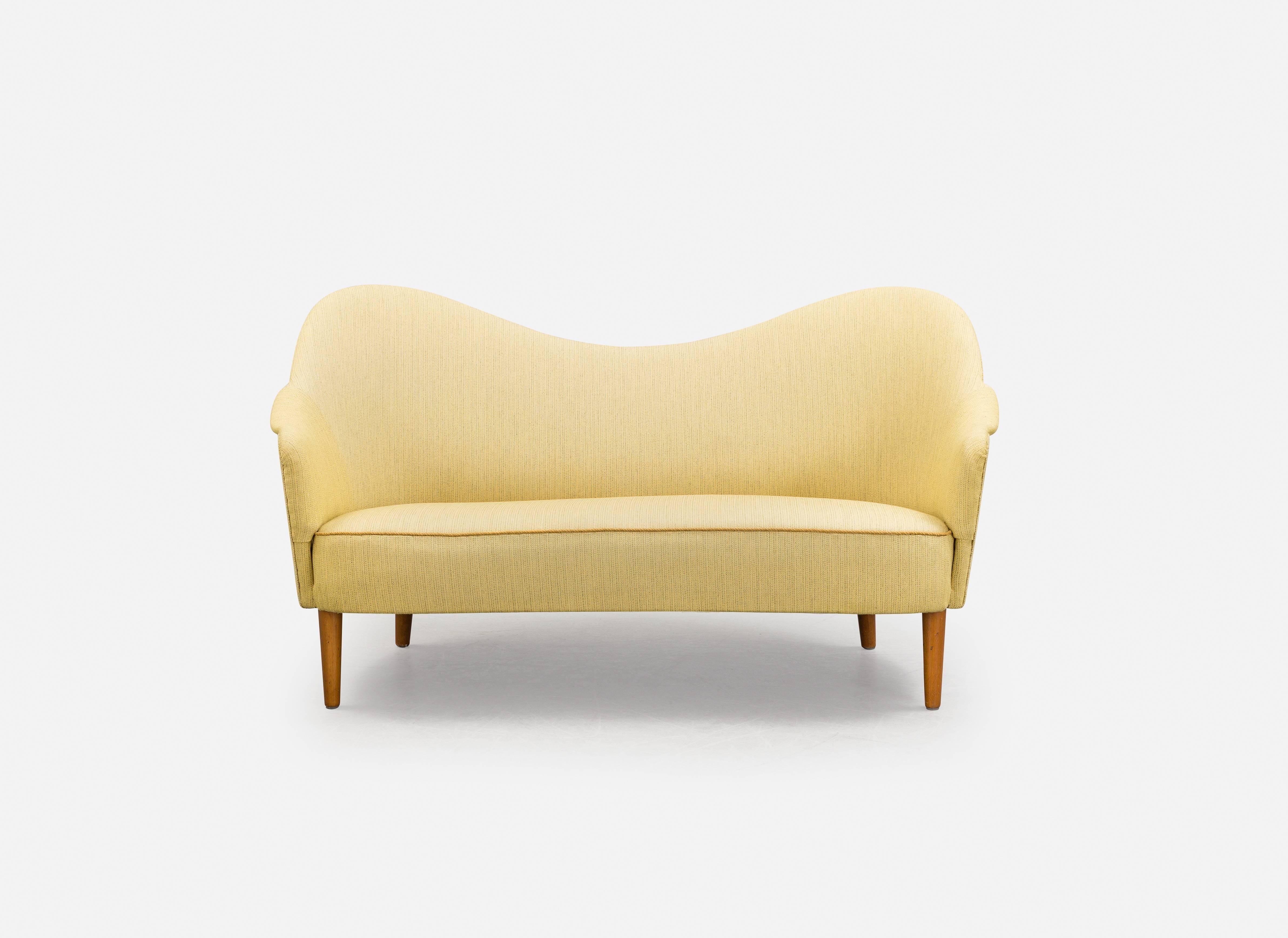 Swedish Carl Malmsten curved yellow Samspel sofa / loveseat, mid 20th Century, Sweden.
