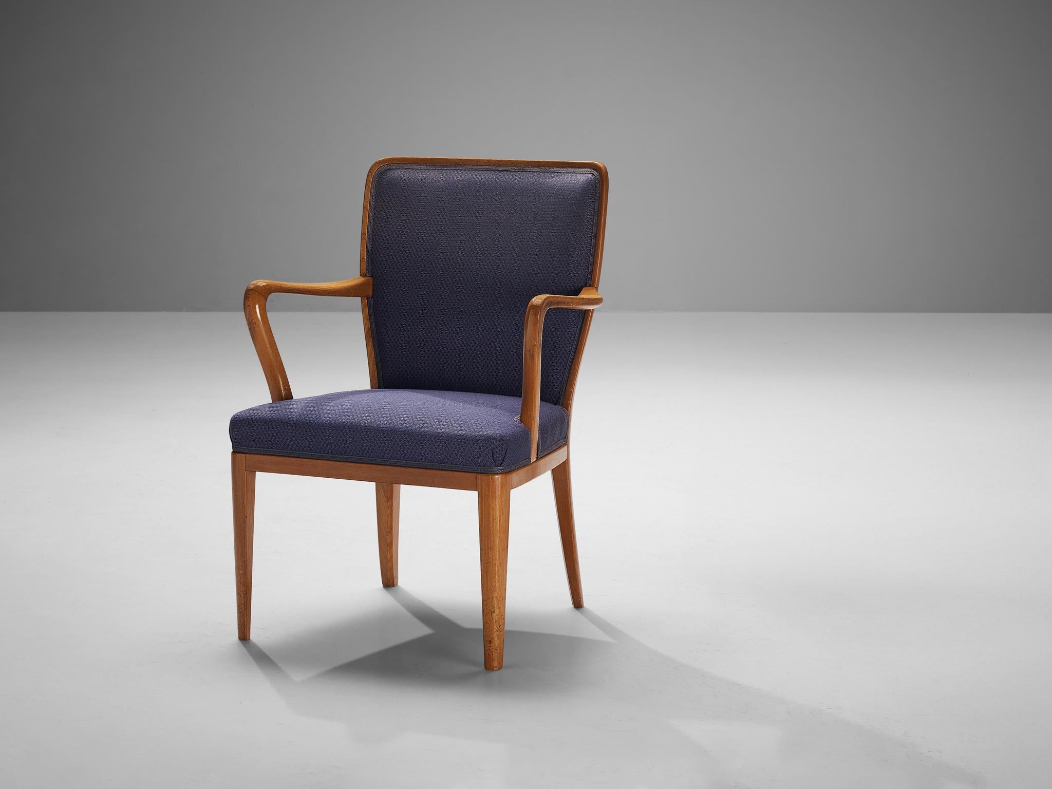 Attributed to Carl Malmsten, armchair, teak, fabric, Sweden, 1950s.

Dining chair in purple upholstery attributed to Carl Malmsten (1888-1972). The unique lines and curves of the design are striking and the tapered wooden legs complement its shape