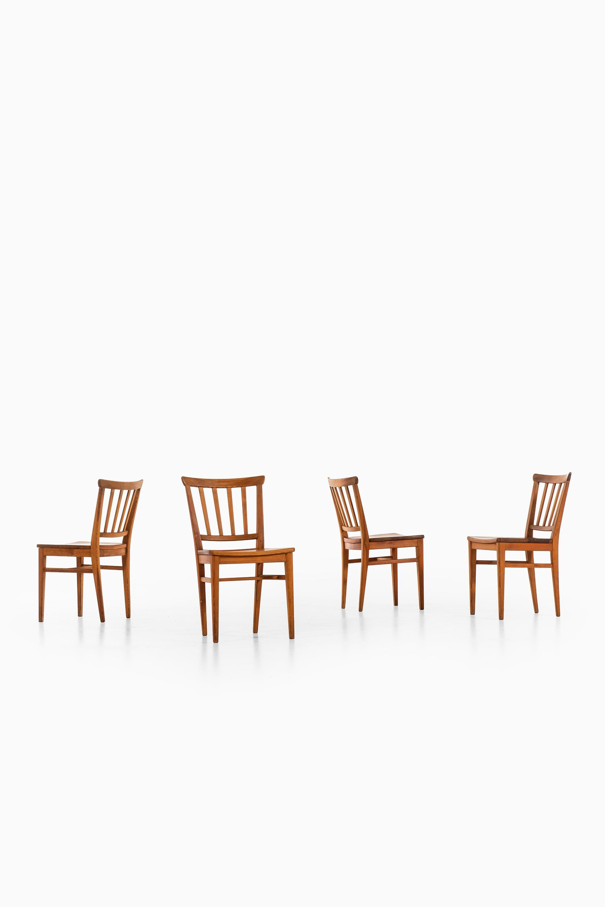 Rare set of 4 dining chairs designed by Carl Malmsten. Produced by Karl Andersson & Söner in Sweden.