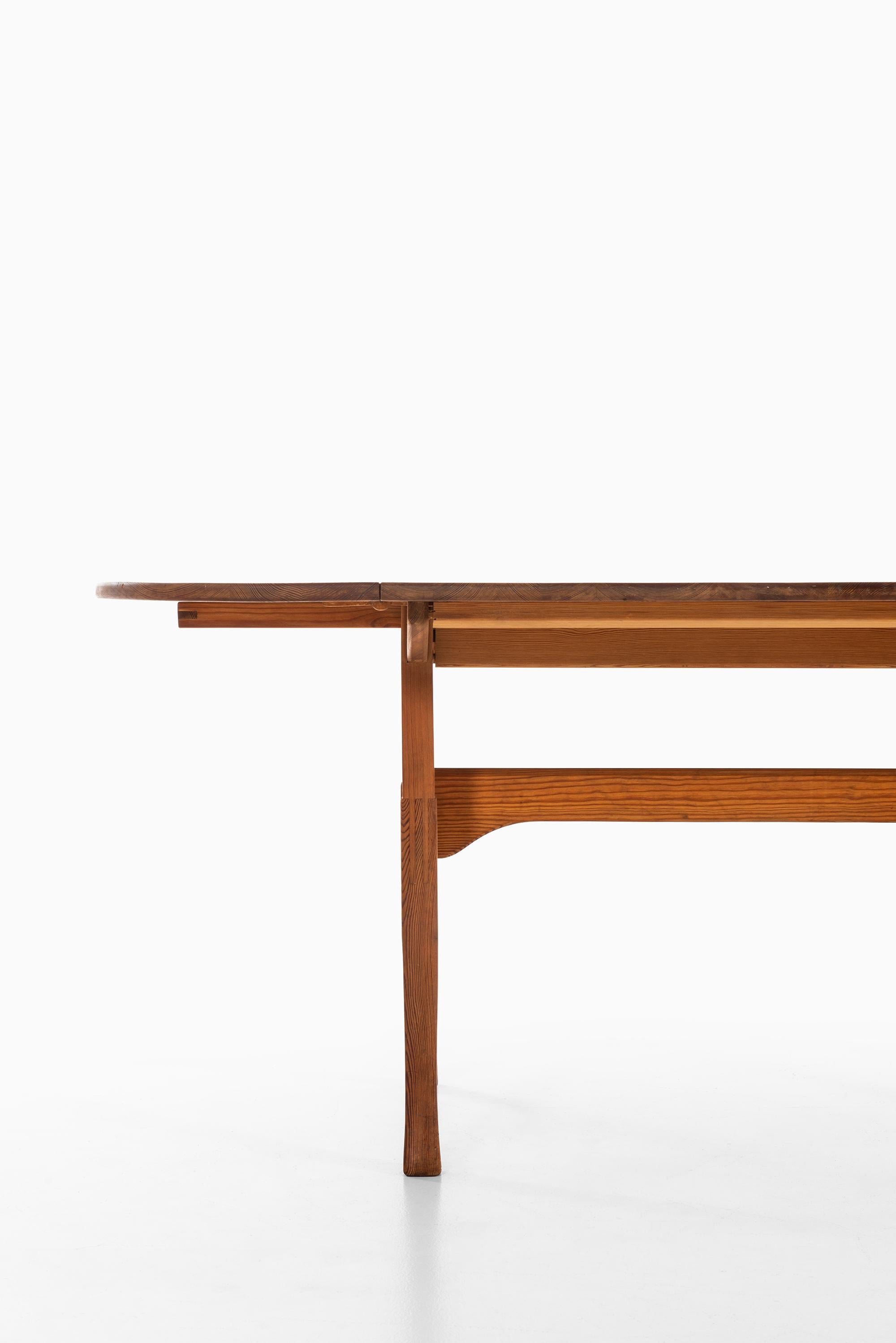 Rare dining table designed by Carl Malmsten. Produced by Karl Andersson & Söner in Sweden.