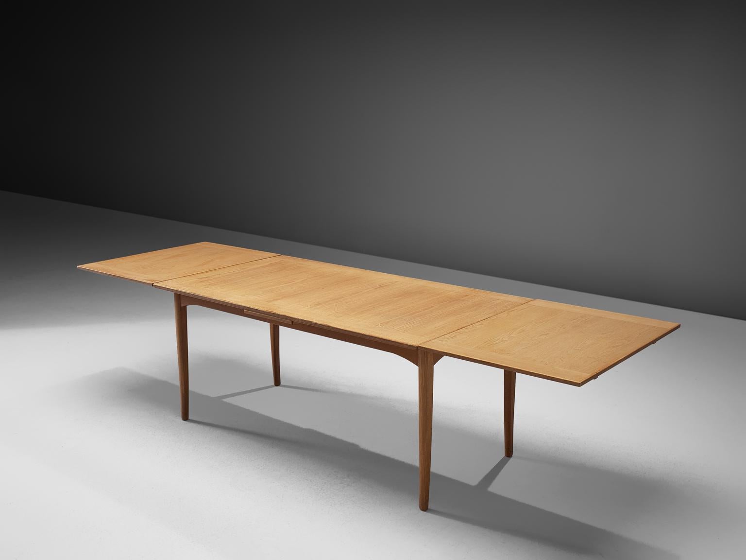 Carl Malmsten, extendable table in oak, Denmark, 1960s.

This well proportioned extendable table has a straight shaped top, it features straight edges and four straight, solid oak legs. The clear shape of the top and the wonderful, modest