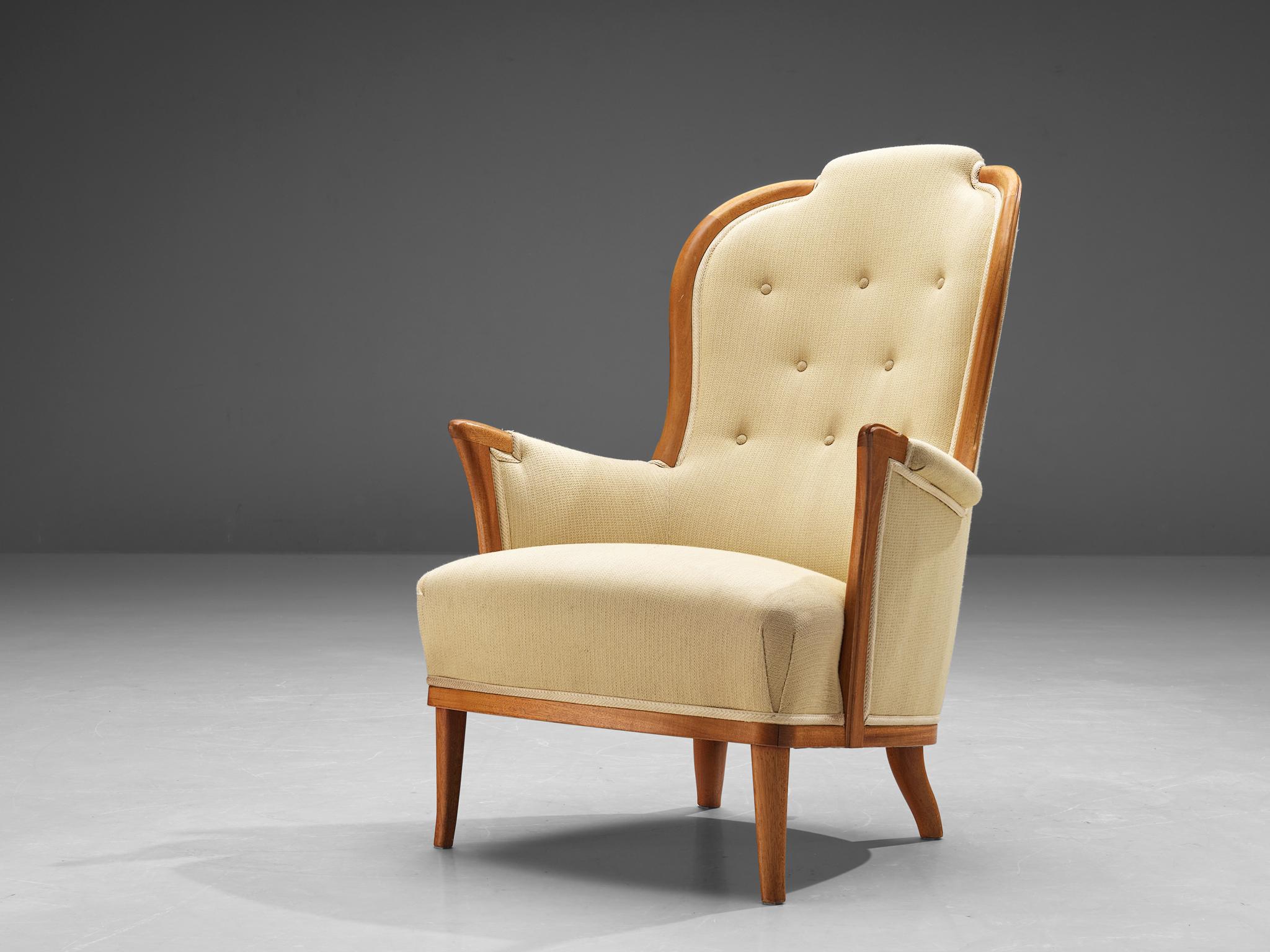 Carl Malmsten for O.H. Sjögren, 'Our Lady' easy chair, teak, fabric, Sweden, 1950s. 

Very interesting Swedish lounge chair by Carl Malmsten in a yellow fabric with tufted back. The distinctive lines and graceful curves of its design create a