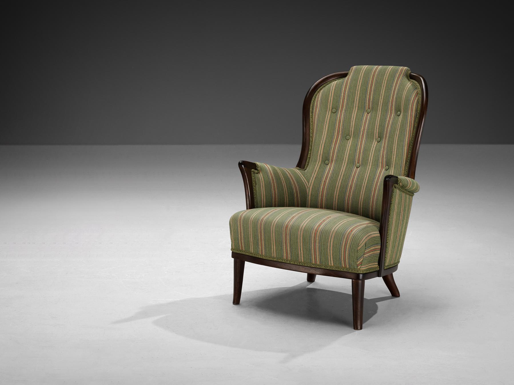 Carl Malmsten for AB O.H. Sjögren, easy chair, fabric, mahogany, Tranås, Sweden, 1987

A wonderful chair that is very well designed by Carl Malmsten. This armchair is upholstered in the original fabric mainly in the color green adorned with colorful