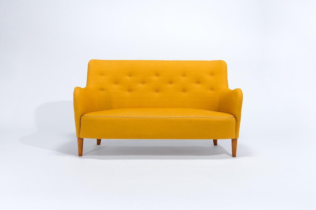 A beautiful two-seater sofa designed by world renowned furniture designer Carl Malmsten. An early example of his Samsas sofa a simple and elegant design with beautifully soft organic curves really define this piece. We have had the sofa stripped