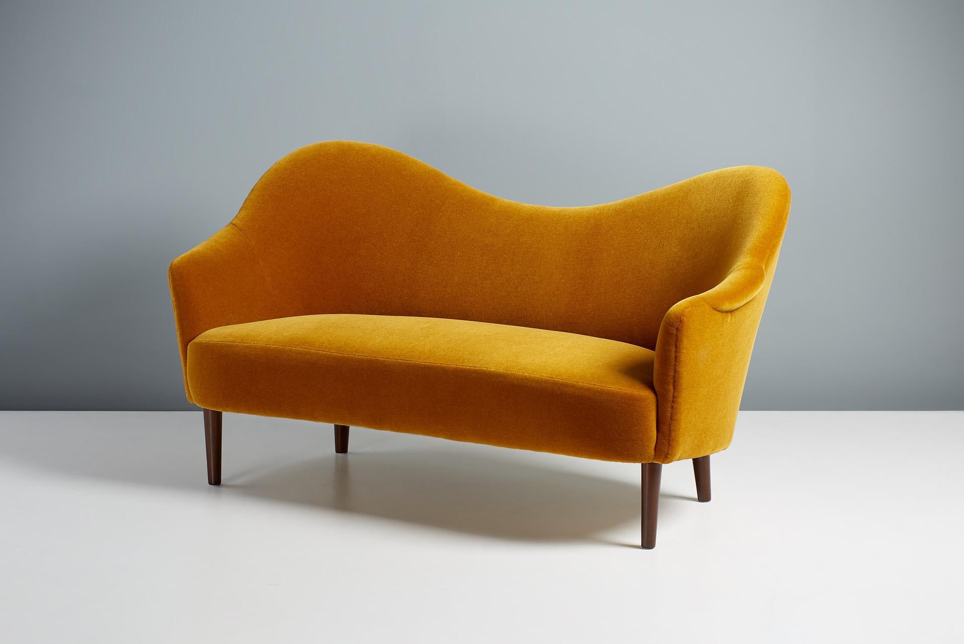 Carl Malmsten - Samspel sofa, 1956

Malmsten's iconic curved sofa was designed in 1956 and produced by Swedish cabinetmakers AB Record in Bollnas. It is considered one the finest examples of Scandinavian Modern sofa design and remains in high