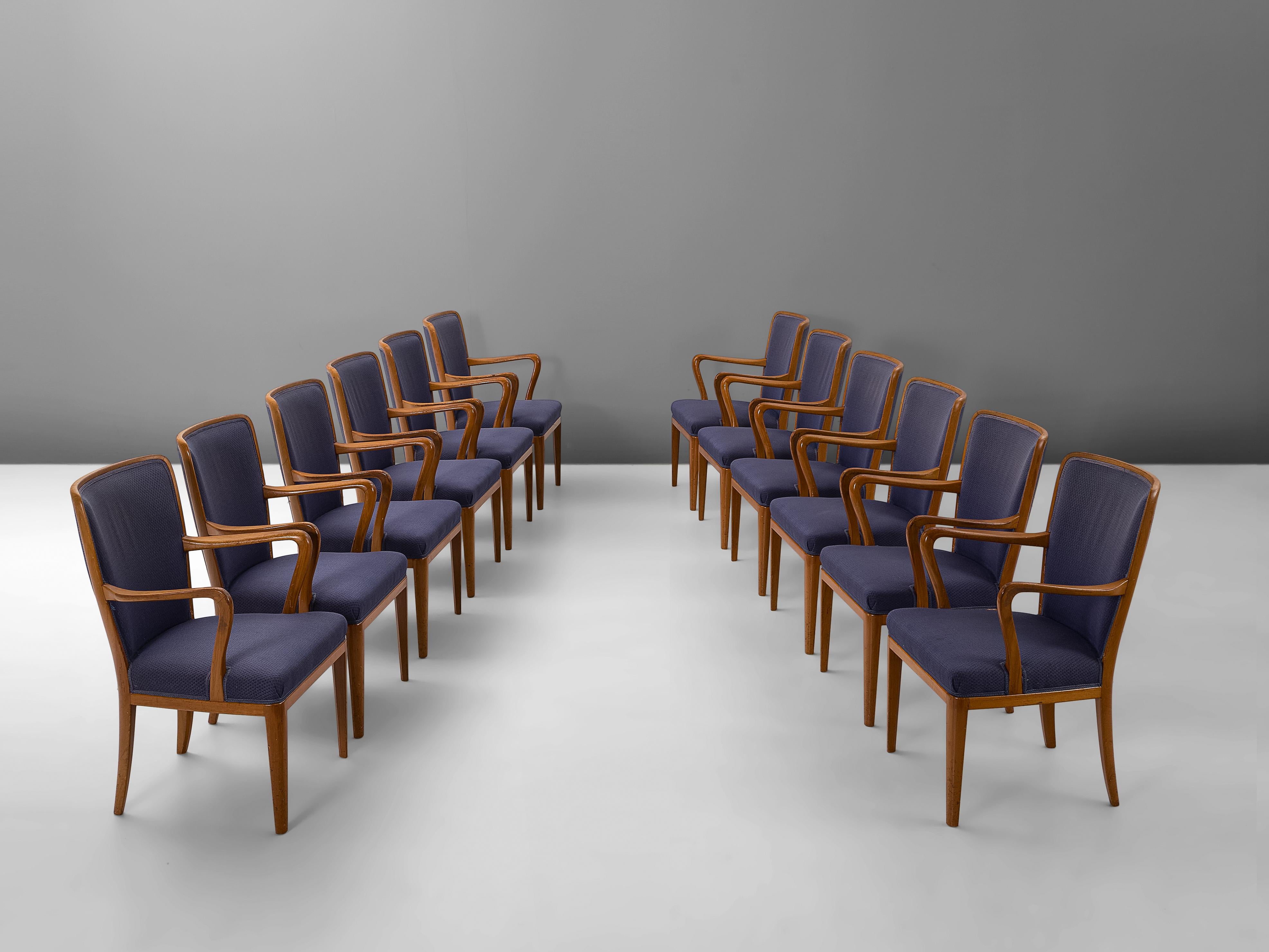 Set of twelve armchairs, in teak and fabric, attributed to Carl Malmsten, Sweden, 1950s.

Set of twelve chairs in deep blue upholstery is attributed to Carl Malmsten (1888-1972). The unique lines and curves of the design are striking and the tapered