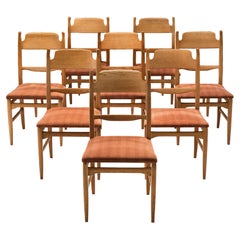Carl Malmsten Set of Eight Dining Chairs in Oak and Orange Upholstery 
