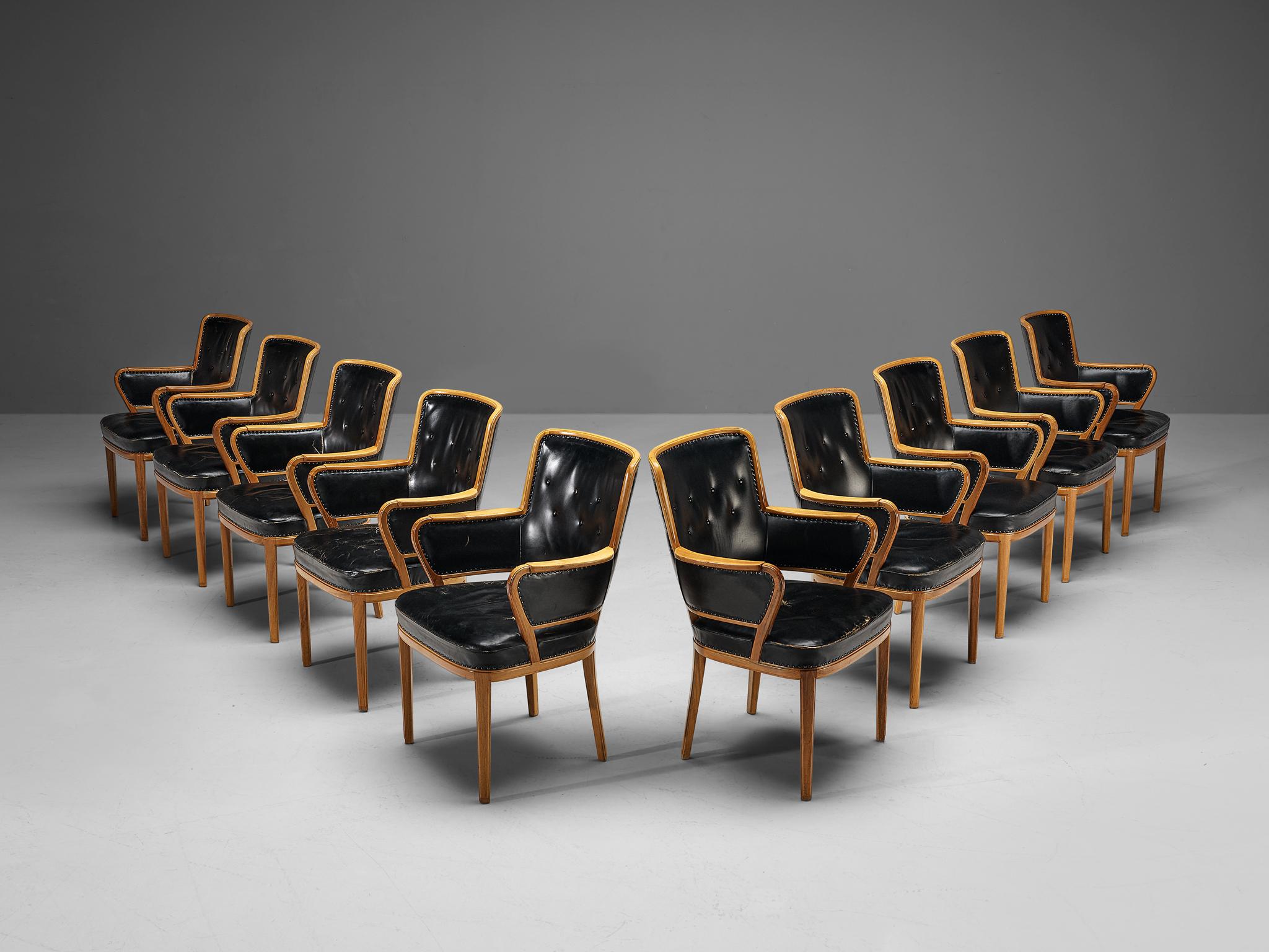 Carl Malmsten, set of ten armchairs, walnut, leather, Sweden, 1940s. 

Rare set of armchairs designed by Swedish designer Carl Malmsten. These chairs contain a warm walnut frame which is nicely visible, and the grain pattern comes out beautifully as