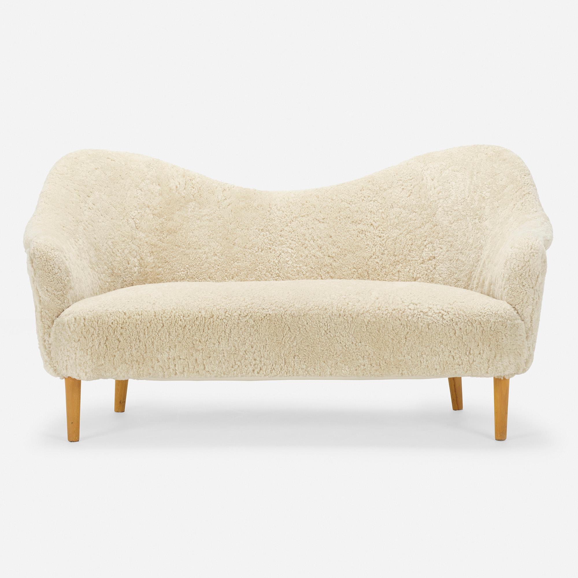 Made in: Sweden, c. 1950.

Material: faux shagreen upholstery, beech.

Size: 63 W × 32 D × 33.25 H in seat height 16.5 inches.