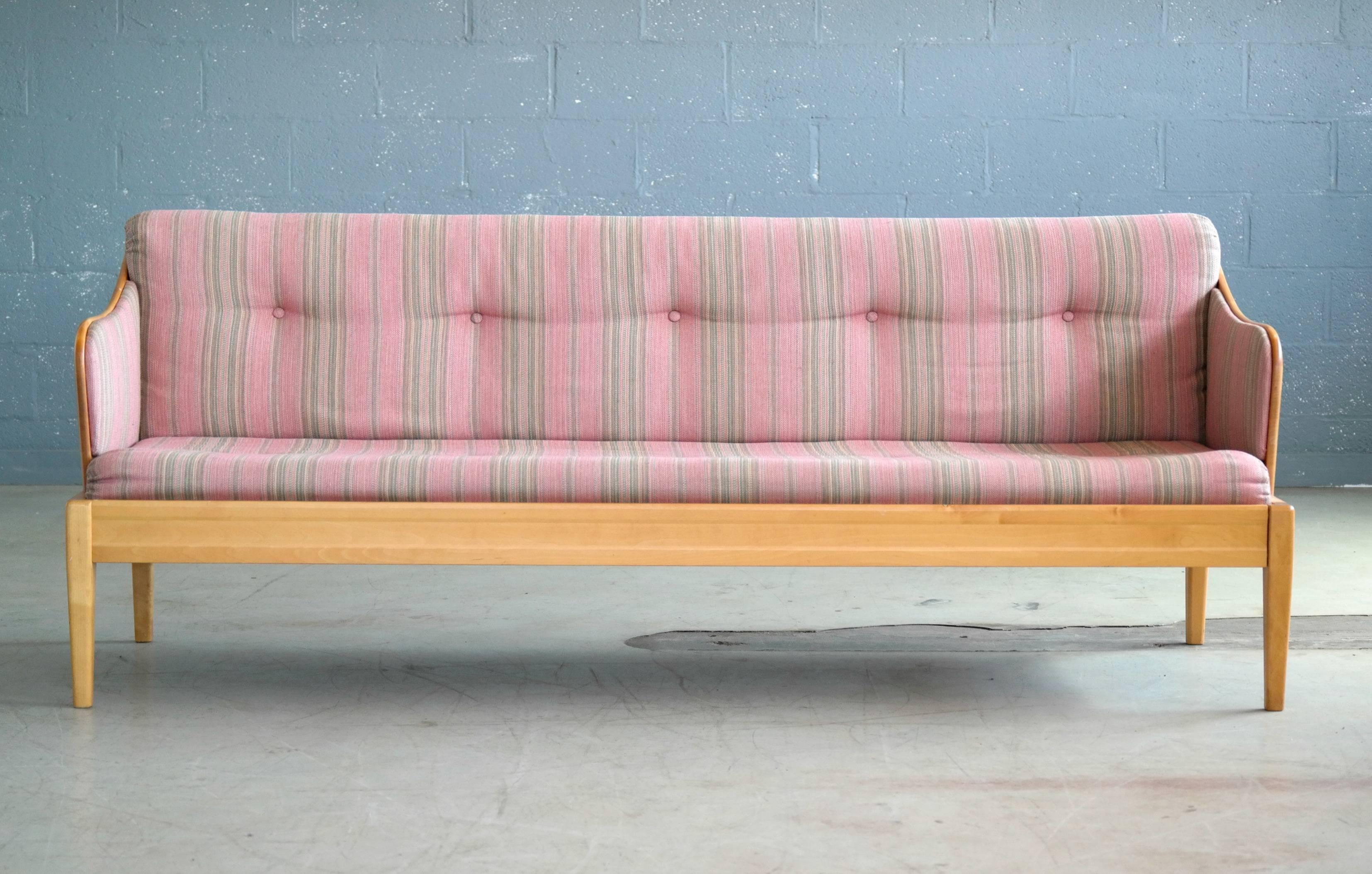 Beautiful birchwood country style sofa designed by Carl Malmsten in the 1940's. This sofa was probably manufactured around 1970 by OH Sjogren. Inspired by Swedish farm or country style furniture this simple yet very refines design is just perfect