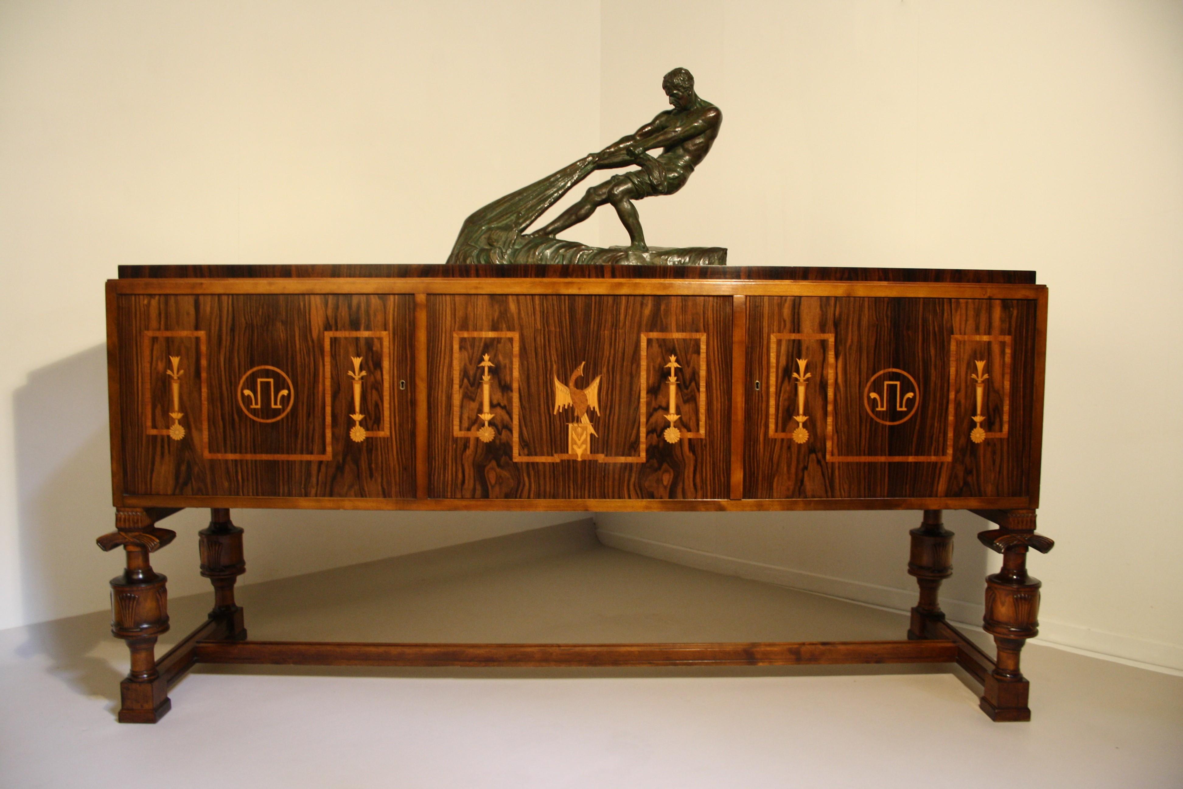Swedish Grace sideboard from Carl Malmsten, with Birch and Jacaranda veneer, baluster-shaped coupled legs with cut decor.
This sideboard is in very good condition and still has its original varnish, the quality of the inlay is extremely