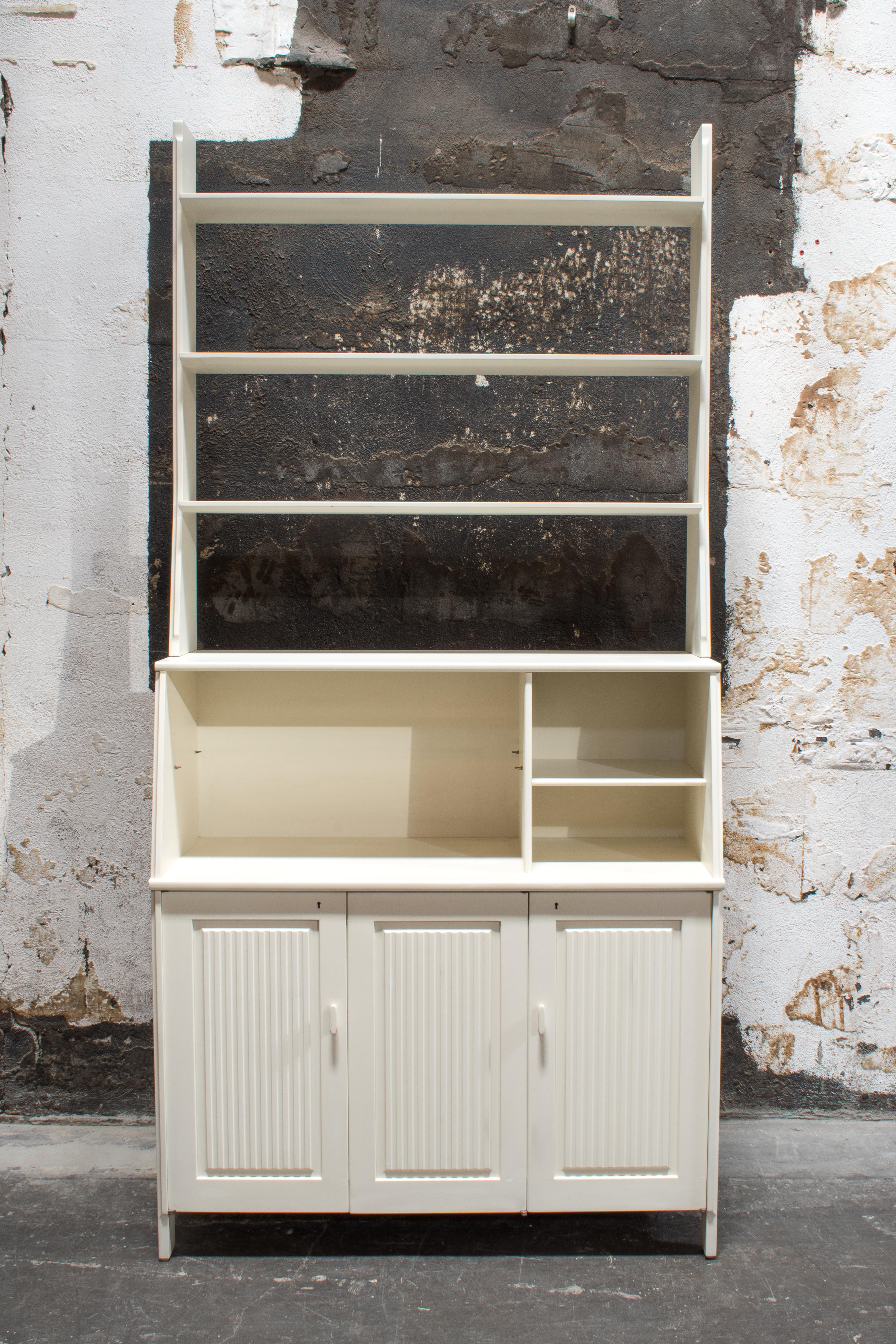 Swedish Modern Bookcase Hutch Credenza With Storage Cabinet, designed by Carl Malmsten. Upper piece has three shelves and hutch. Lower piece has three doors, two Gustavian Blue interior sections with shelving. Key included.