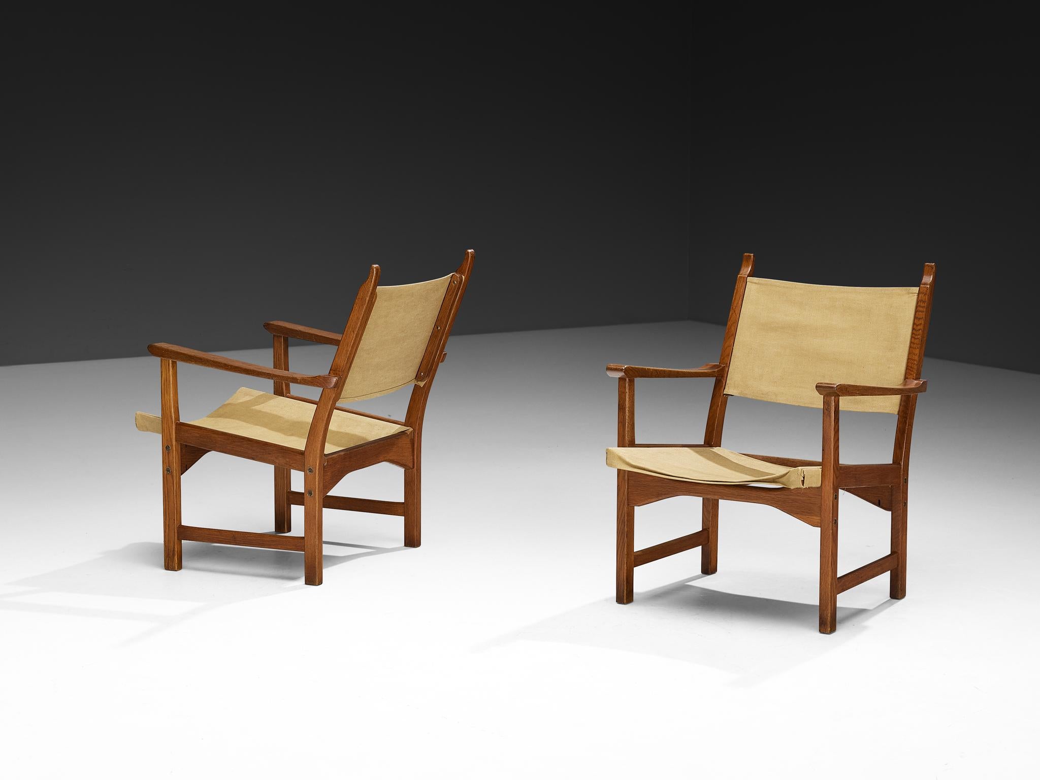 Carl Malmsten and Yngve Ekström for Swedese, 'Caryngo' armchairs, oak, canvas, Sweden, 1955

These Caryngo lounge chairs by Carl Malmsten and Yngve Ekström features an oak frame and canvas seating. The linen is securely attached within the frame,