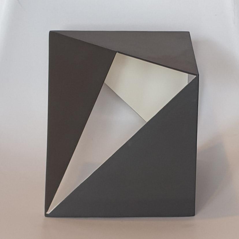 Steel 77 is a unique small size contemporary modern abstract sculpture by Dutch artist Carl Möller. This work explores the effect of adding and deleting diagonal planes in a perfect steel cube of 20x20x20 cm. In doing so, the artist creates open