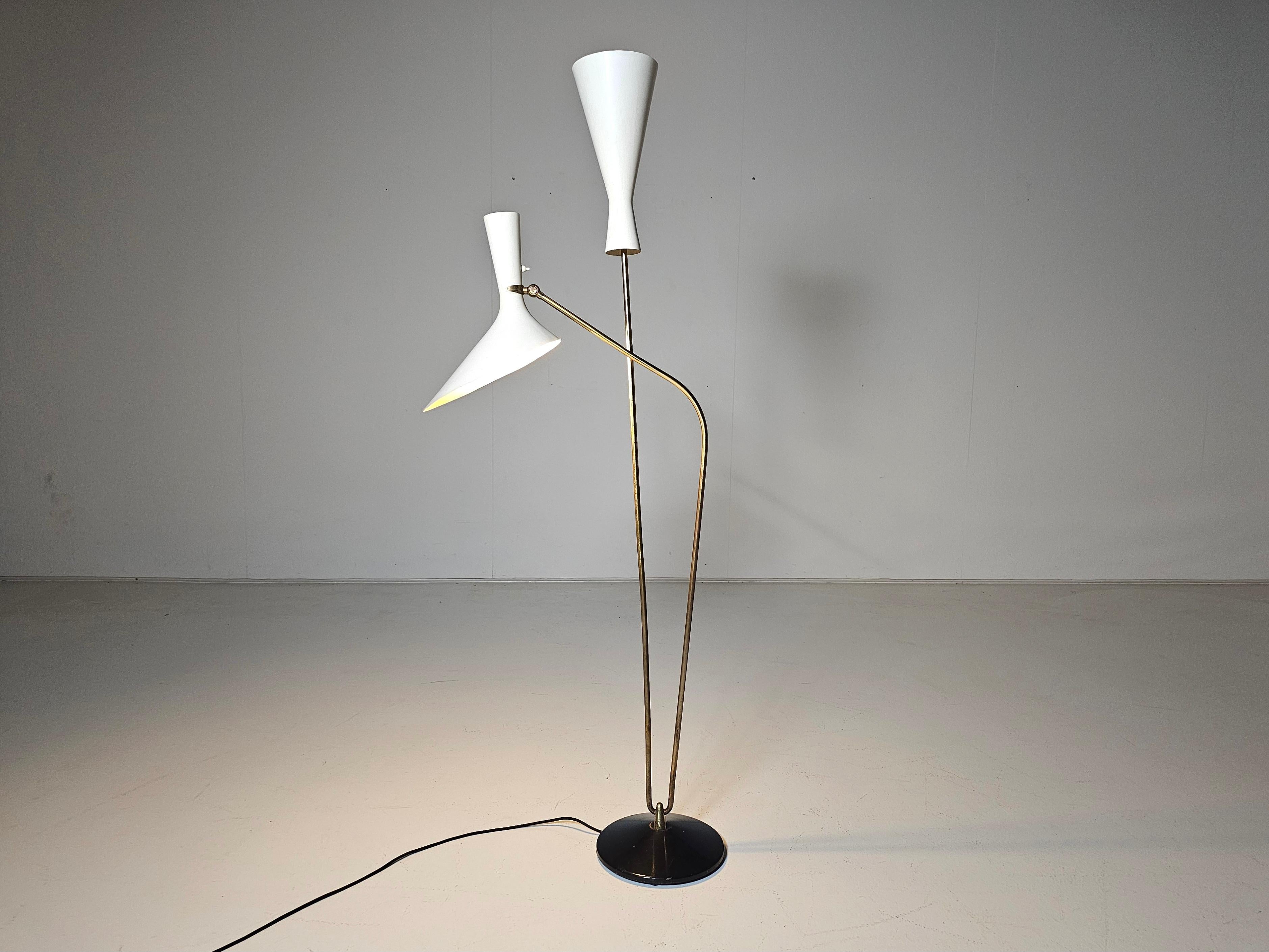 Beautiful very rare and ORIGINAL floor lamp designed by Professor Carl Moor and manufactured by BAG Turgi.  The lamp was produced in different versions. This is the luxurious version with a solid base and brass rods.

It stands as a beacon of