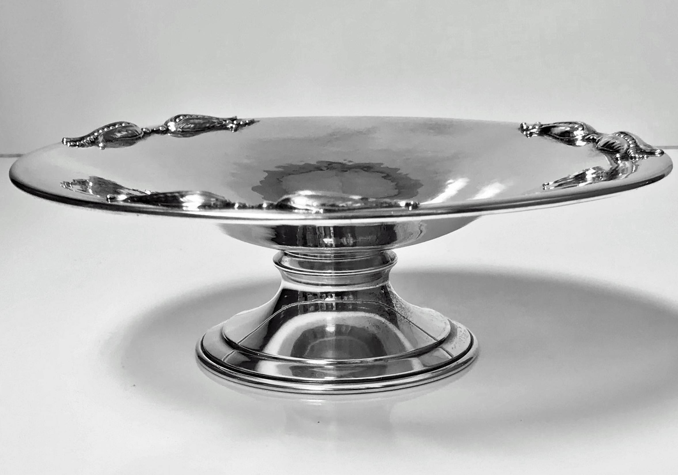 Carl Poul Petersen pedestal dish, Montreal, circa 1950. Plain polished sterling silver with triple corn accent applied border decoration. Measures: 6.75 x 2.25 inches. Total item weight: 162.15 grams. Full Petersen marks and handmade sterling.