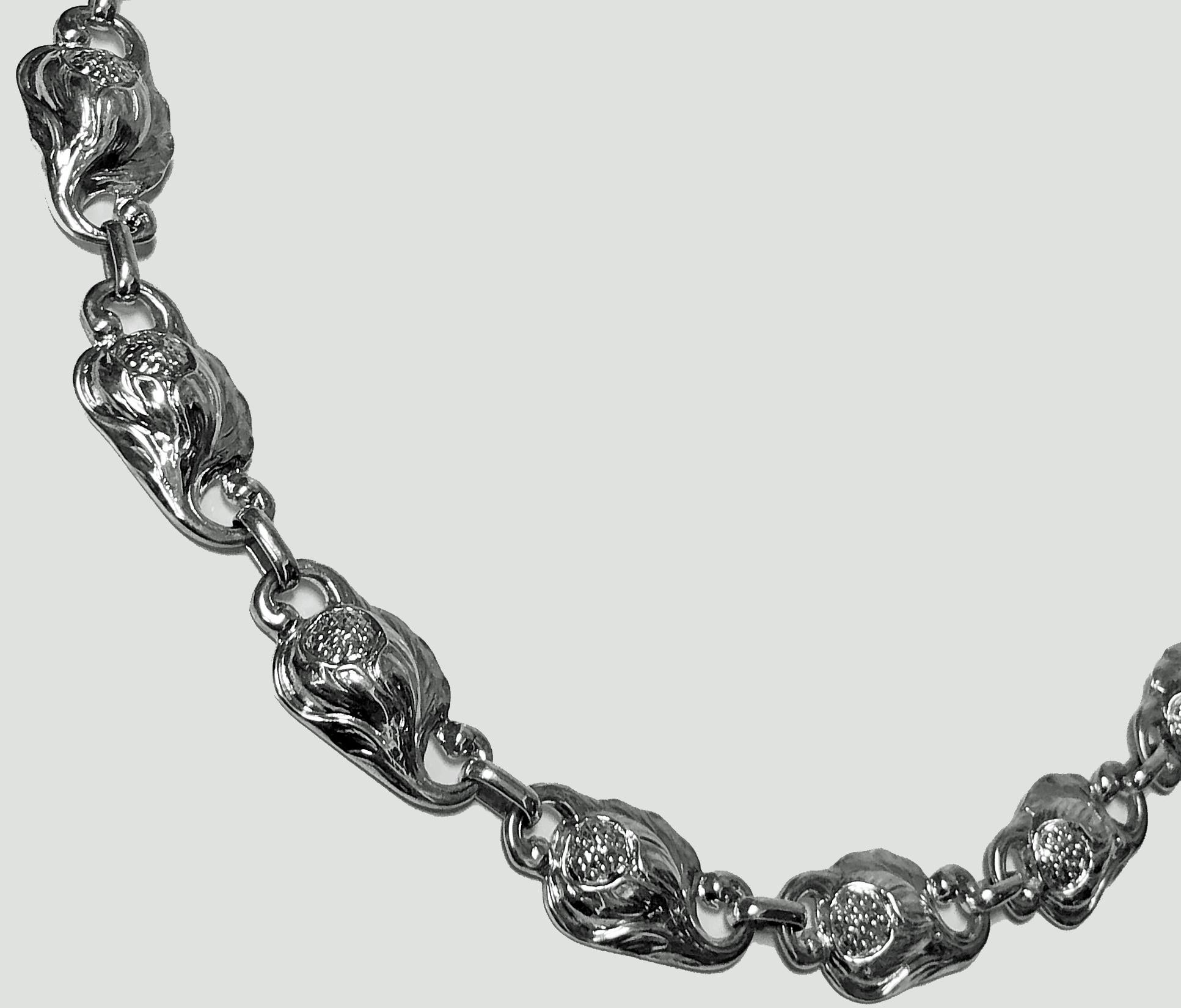 Carl Poul Petersen hand made Sterling Silver Necklace, Montreal C.1940. The Necklace with sixteen organic foliate open bud motif links, spring ring fastener. Reverse with marks hand made Sterling PP for Petersen and Canadian silver mark. Length: 20