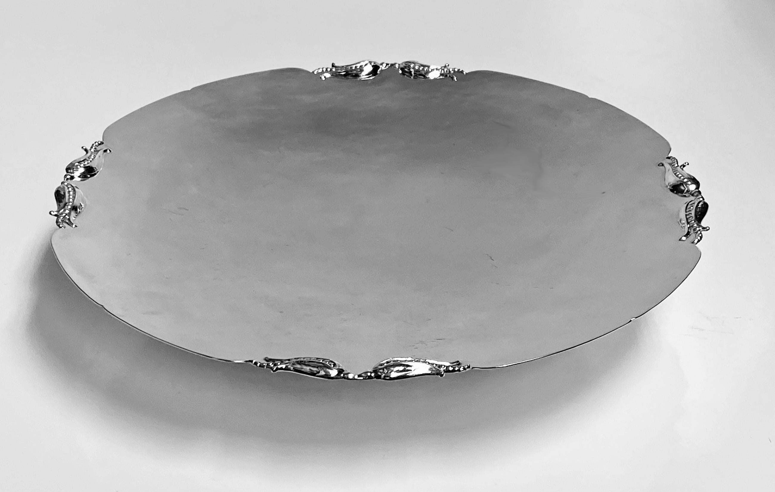 Sterling silver Tazza dish, Carl Poul Petersen Montreal, circa 1940. Plain on pedestal base, slightly scalloped with corn husk intervals. Measures: Diameter 10 inches, height 1.75 inches. Weight: 419 grams. (13.47 oz). Very good condition. Petersen