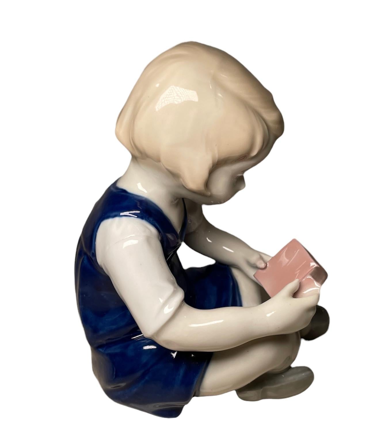 Hand-Painted Carl Scheidig German Hand Painted Porcelain Figurine of a Girl Reading a Book