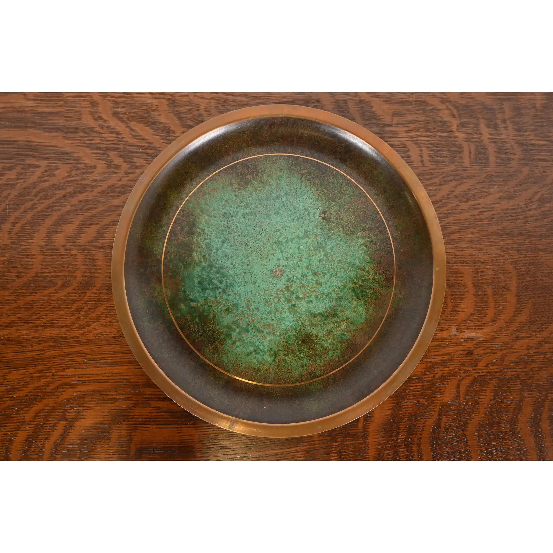 A beautiful Art Deco or Arts & Crafts period verdigris bronze large charger plate or serving tray

By Carl Sorensen

USA, Early 20th Century

Measures: 14.38