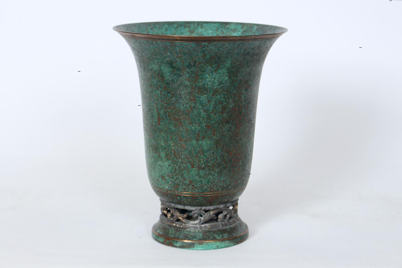 Tall Art Deco Bronze Trumpet Vase by Philadelphia metalsmith and Tiffany designer Carl Sorensen. Featuring a handcrafted vase form, polished GOld toned Bronze horizontal rimmed decoration to the top and base with bright Green Verdigris patina