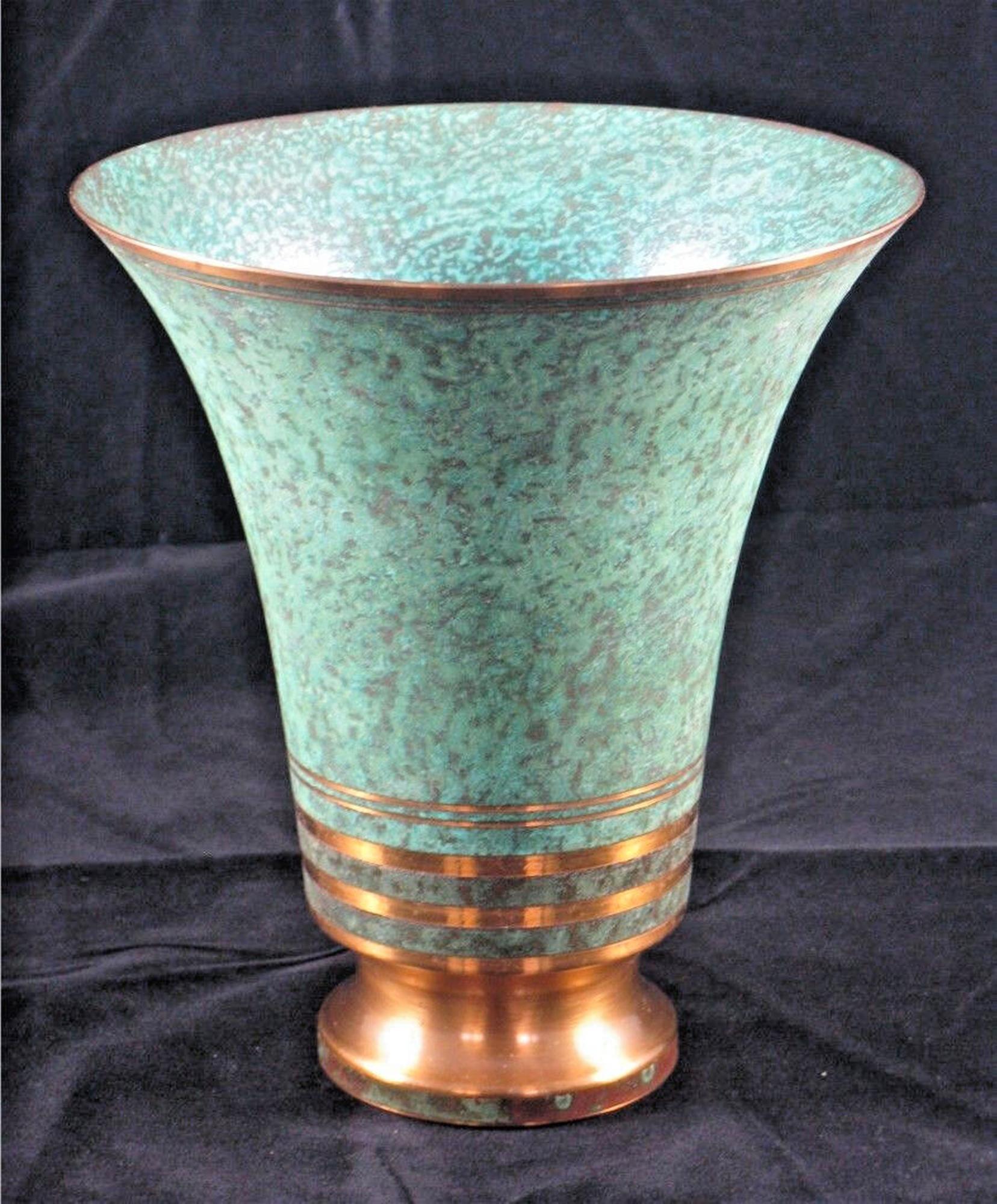 Carl Sorensen Bronze Vase,
Arts and Crafts Movement,
Philadelphia, PA,
Early 1900s

The copper and bronze vase with a flared top is finished in a verdigris patina.

Dimensions: 7 1/8 inches high x 5 7/8 inch diameter

Mark: Signature on base

In