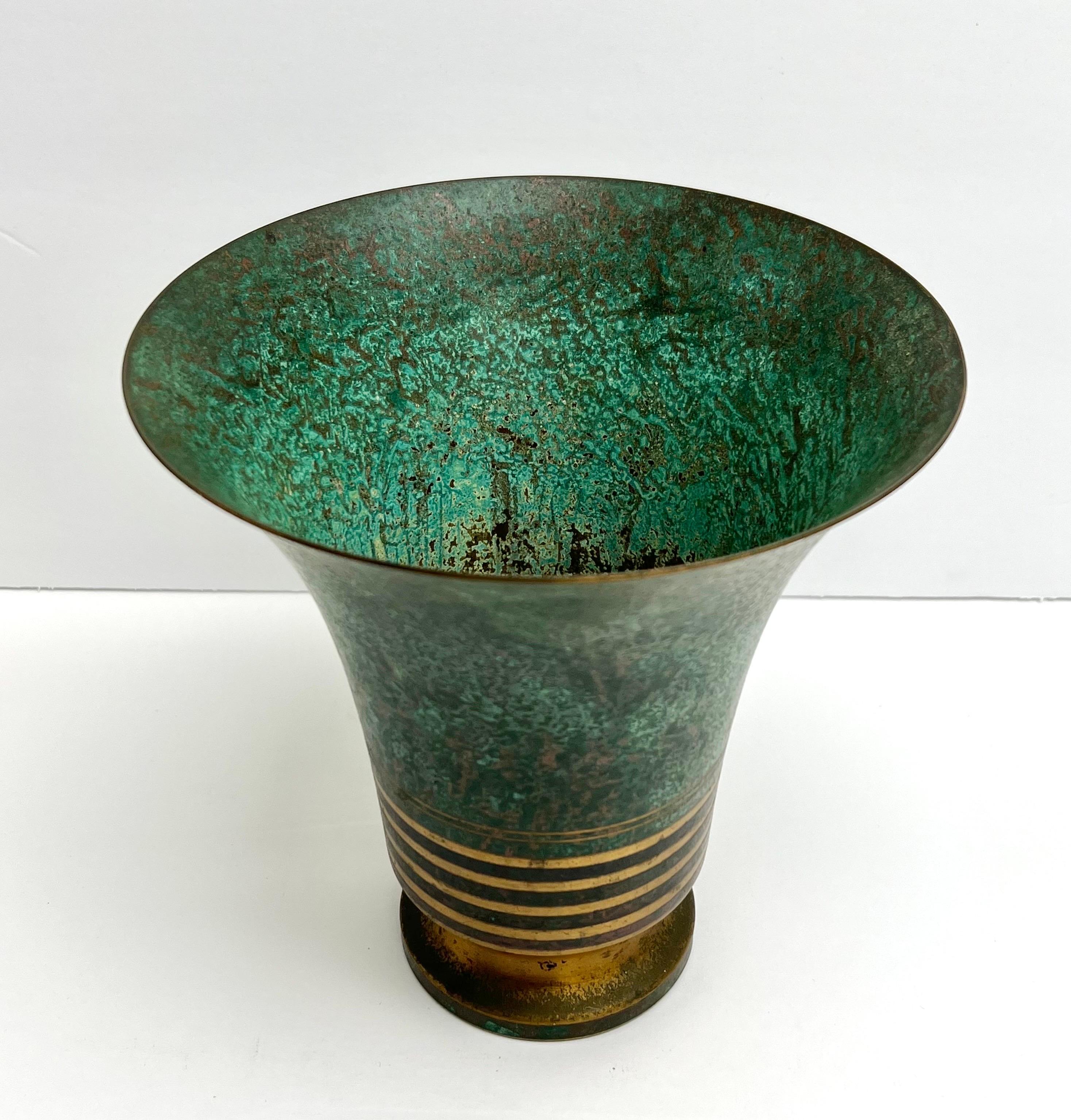 A patinated bronze urn vase by Carl Sorensen. In good condition.