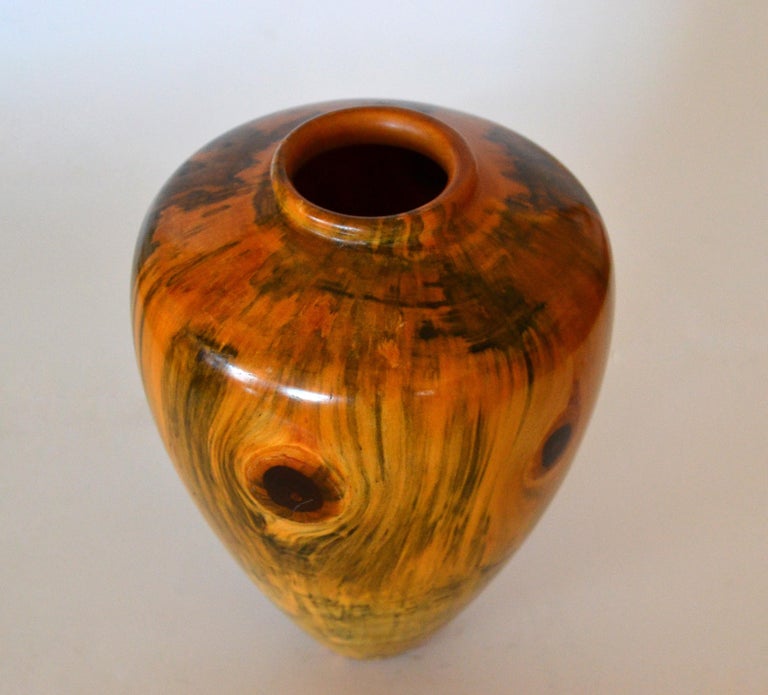 Original Carl Spinner decorative American Craftsman Art handcrafted exotic turned wood and lacquered flower vase.
Marked at the base by Artist and numbered 224.
Stunning wood grain pattern.
 