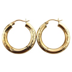 Carla 14 Karat Yellow Gold Textured Hoop Earrings #18903