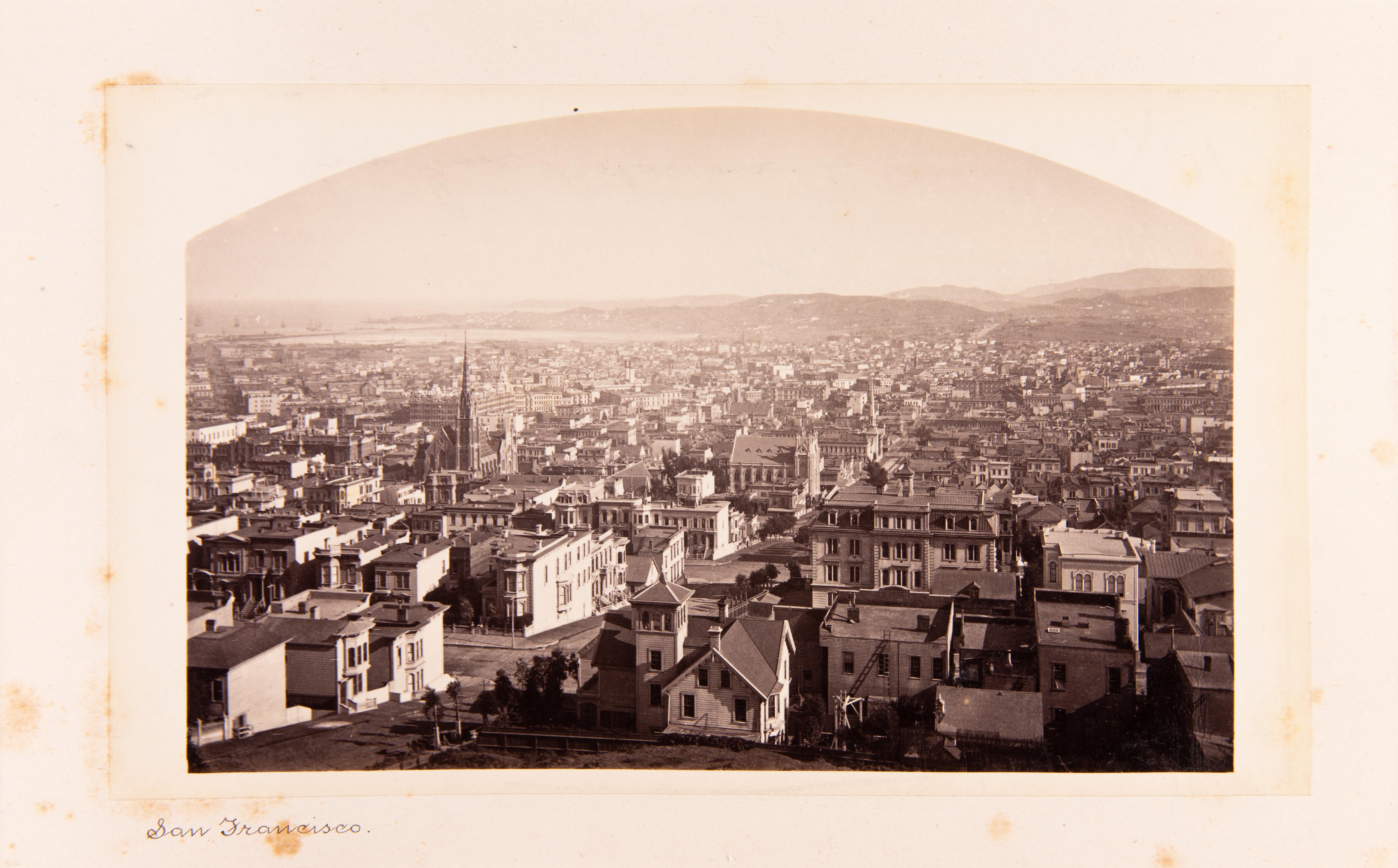 An intimate, rich, dome-topped albumen print of a scene in the Calaveras Grove, north of Yosemite and Mariposa on the western edge of the Sierras. This print is mounted to a thick album board with a title in ink beneath the print. Another