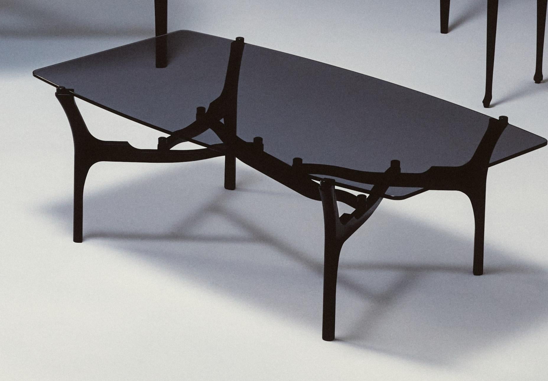 Carlina Low Table by Oscar Tusquets
Dimensions: D 72 x W 130 x H 42 cm.
Materials: Solid ash timber and tempered smoked glass.

Solid ash timber structure, stained black. 1 cm Thick tempered smoked glass top.

Gaulino Family
Distinctive