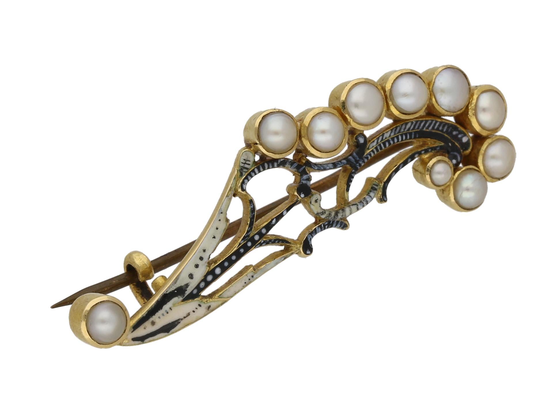 Pearl and enamel brooch by Carlo and Arthur Giuliano. Set with ten round natural pearls in closed back rubover settings, to an elegant openwork floral spray shape cluster with very fine enamel detailing and secure pin brooch fitting to reverse.