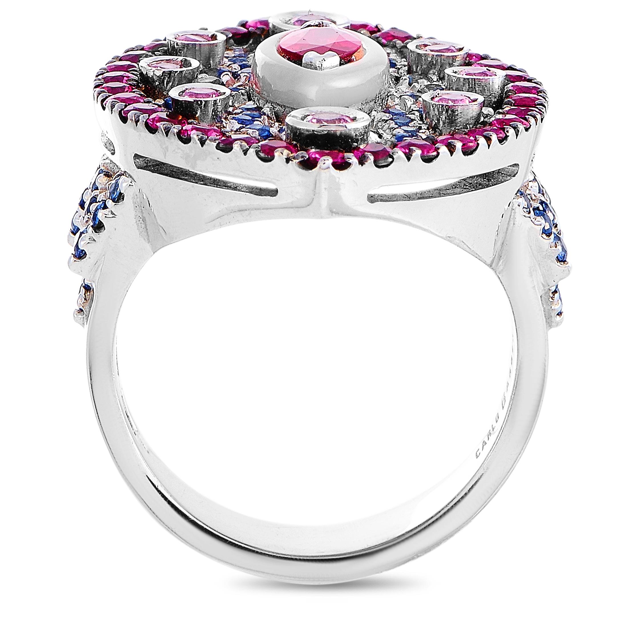 This Carlo Barberis ring is crafted from 18K white gold and embellished with sapphires and rubies. The ring weighs 14.7 grams, boasting band thickness of 4 mm and top height of 4 mm, while top dimensions measure 22 by 19 mm.
 
 Offered in brand new
